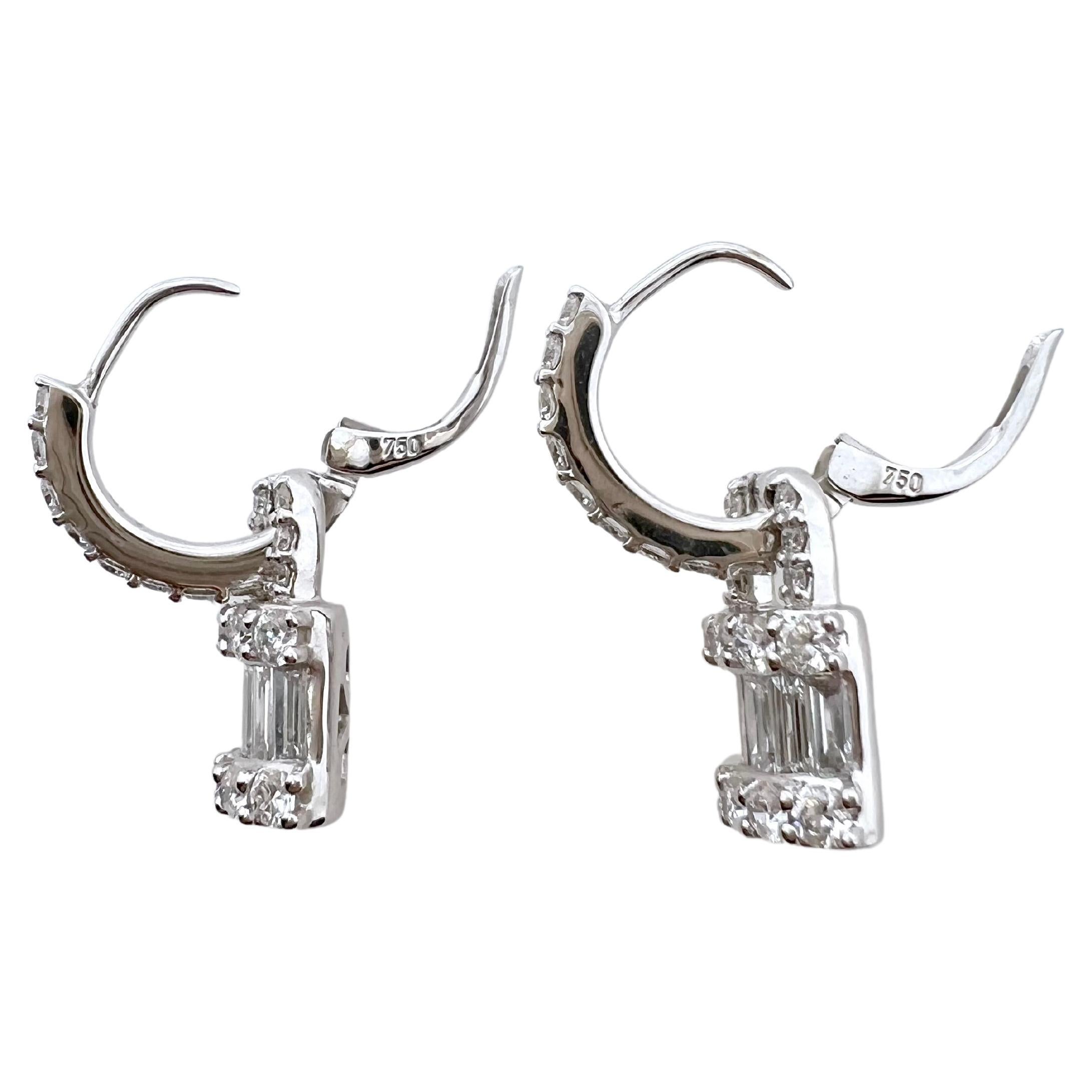 This pair of earrings are absolutely stunning and will be your favorite go to pair.  The gorgeous baguettes are channeled set amongst the round diamonds.  The lock design dangle from the upper hoop to make it have some movement and more playful