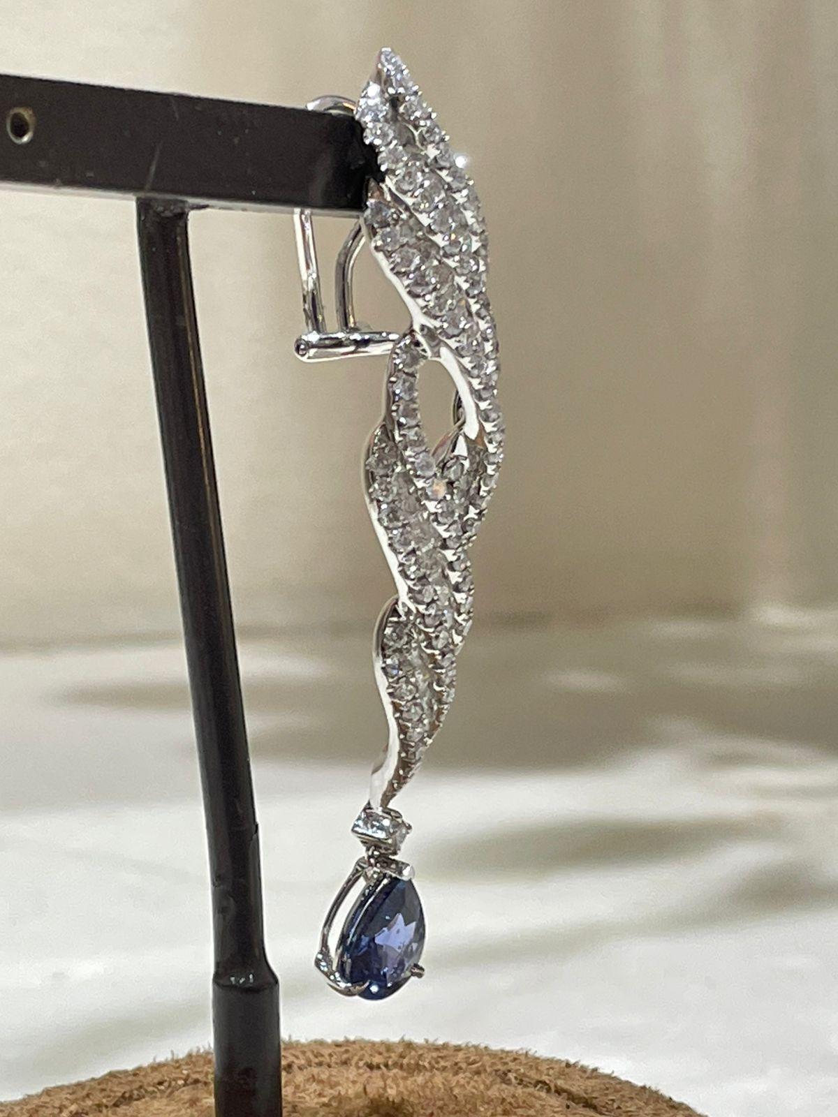 Art Deco 18k White Gold Dangling Earrings with Blue Sapphire and Round Cut Diamonds For Sale