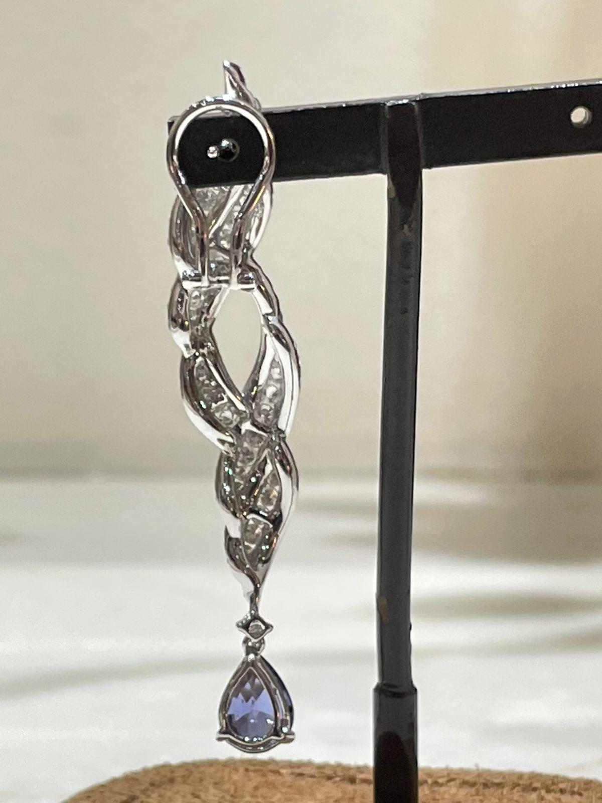 Women's 18k White Gold Dangling Earrings with Blue Sapphire and Round Cut Diamonds For Sale