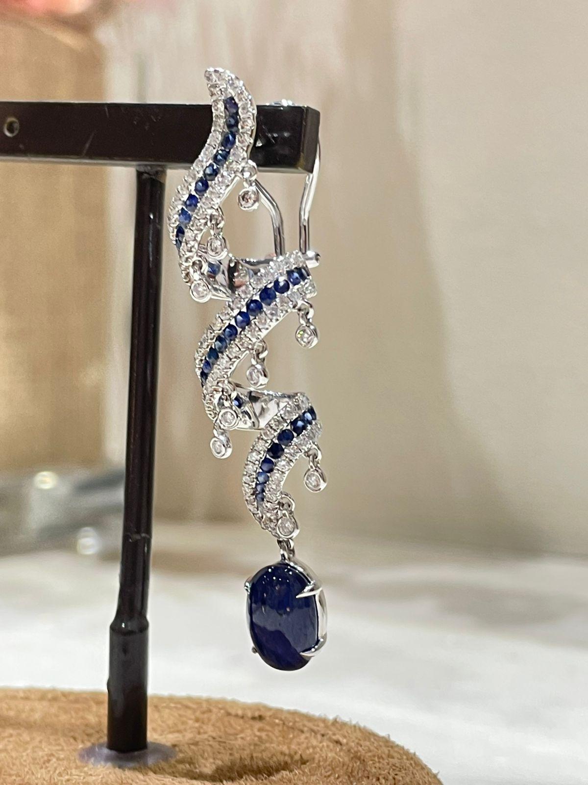 Art Deco 18k White Gold Dangling Earrings with Blue Sapphires and Round Cut Diamonds For Sale