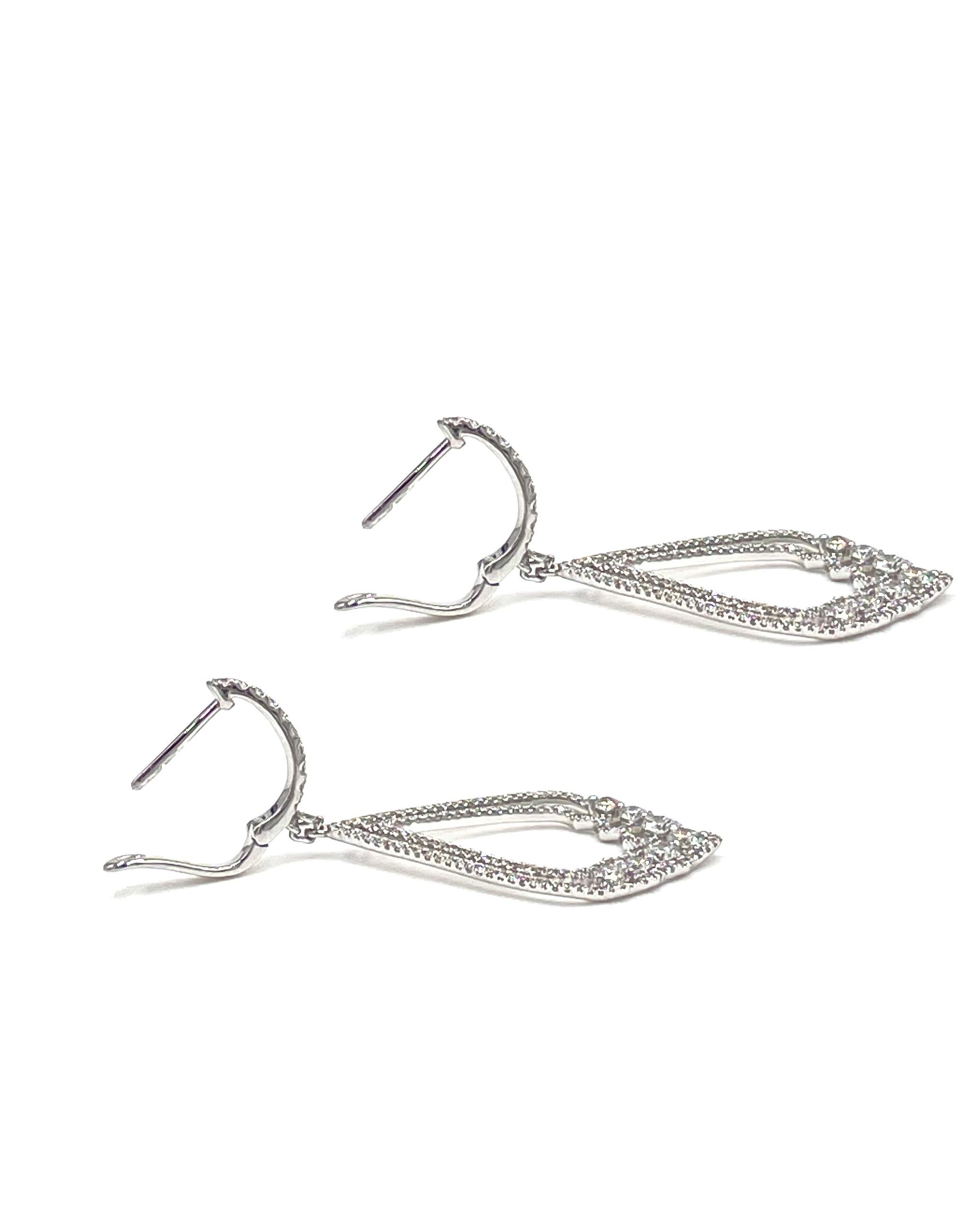 Pair of 18K white gold dangling earrings with  open teardrop design.  The earrings are furnished with graduating round brilliant-cut diamonds weighing 1.60 carats total. 

- The diamonds are G color, VS2/SI1 clarity.