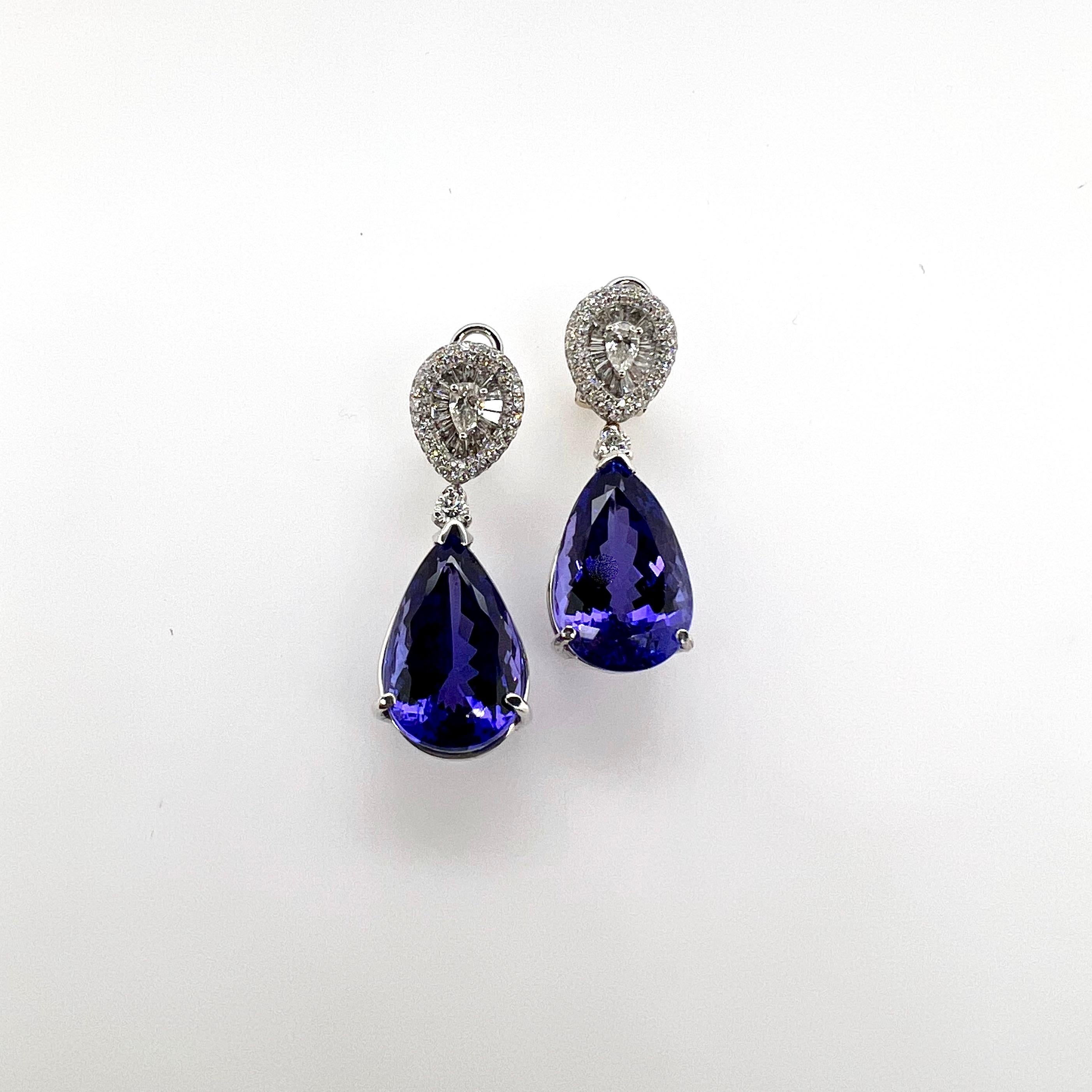 These gorgeous pear shaped, tanzanite dangling earrings will be stunning for all occasions!  The tanzanites are vibrant and well matched that glistens with sparkles!  The top also coincides with the pear shaped tanzanite as we created a pear shaped