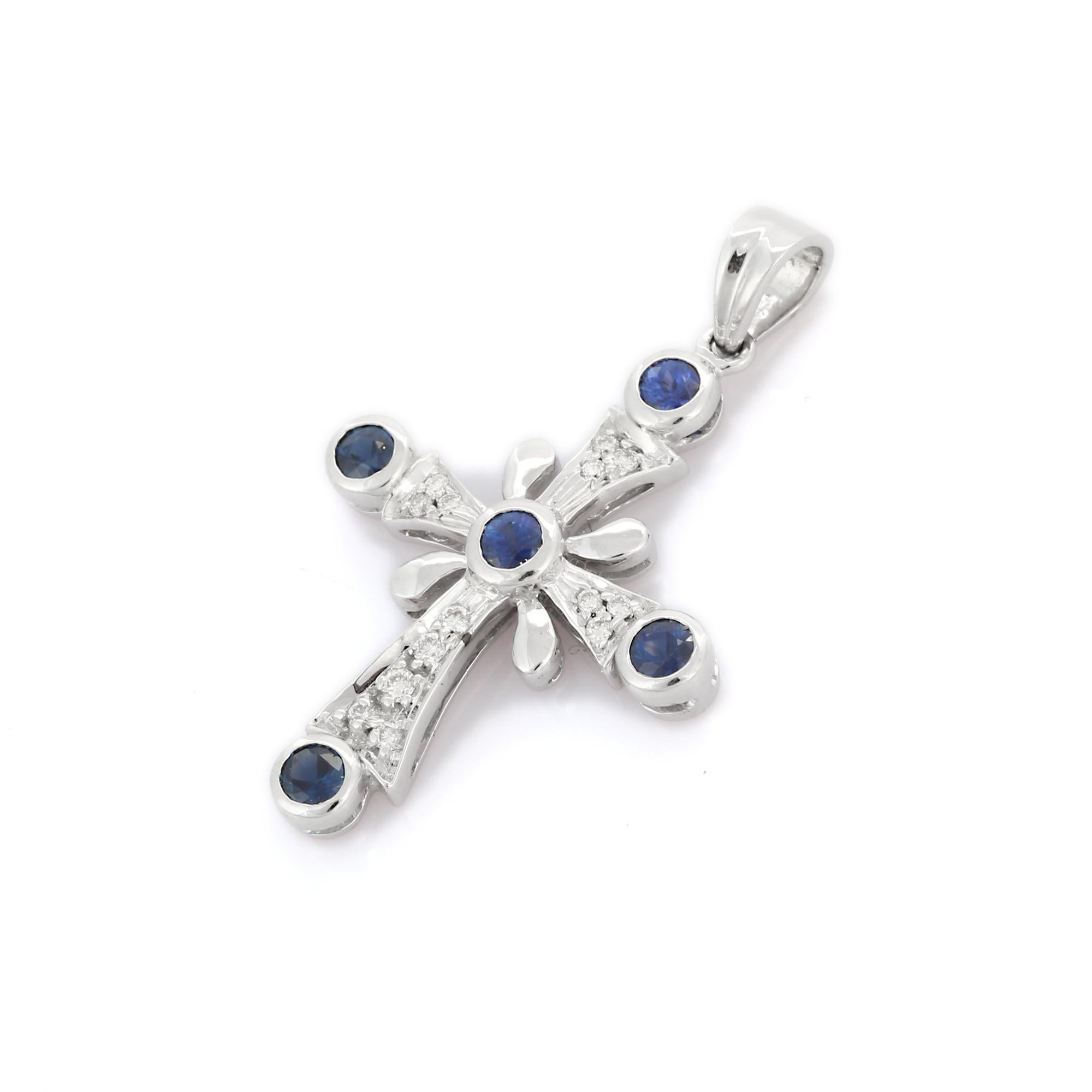 Natural blue sapphire cross pendant in 18K gold. It has square cut sapphires studded with diamonds that completes your look with a decent touch. Pendants are used to wear or gifted to represent love and promises. It's an attractive jewelry piece