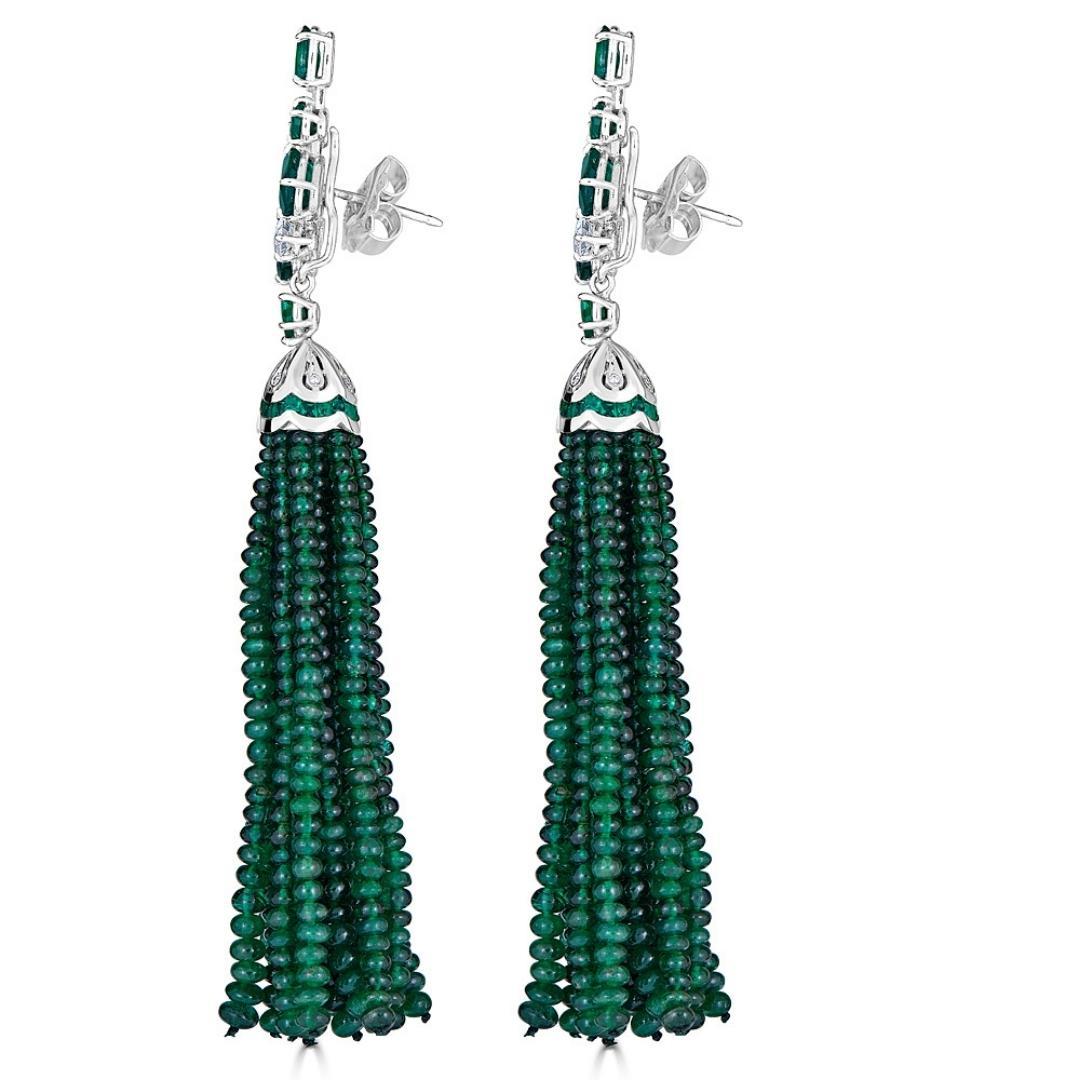 A pair of Emerald and Diamond Cluster Earrings with Detachable Tassels made of natural Emerald Beads. Hand crafted from 18k white gold, these earrings feature 10.45 carats of natural faceted green emeralds, 0.95 carats of white diamonds and