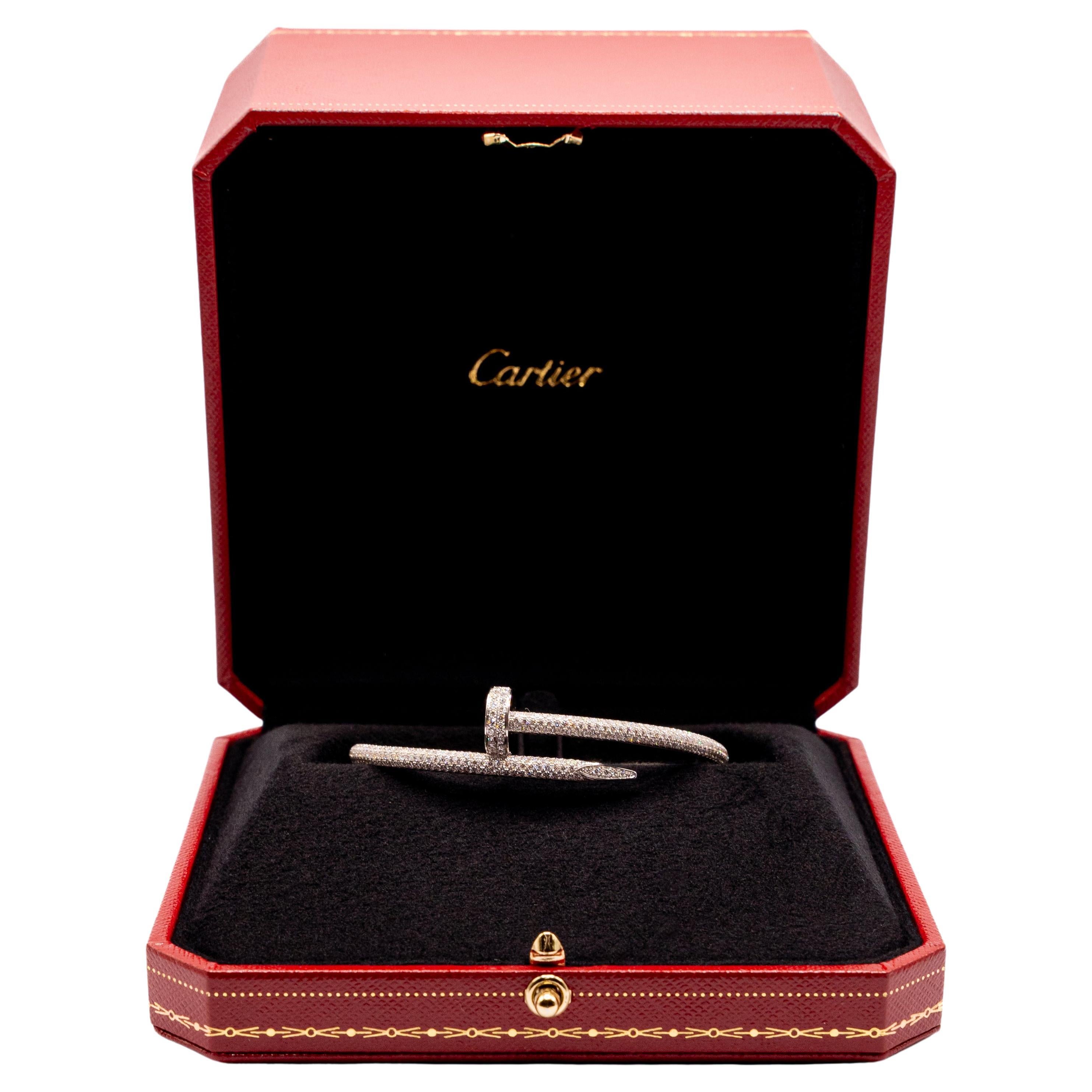 A stunning 18k white gold diamond bangle by Cartier from the Juste Un Clou collection. The bangle is of a nail design, fully pave set around the outer side with 374 round brilliant cut diamonds totalling 2.26ct. The bangle measures 3.5mm at the
