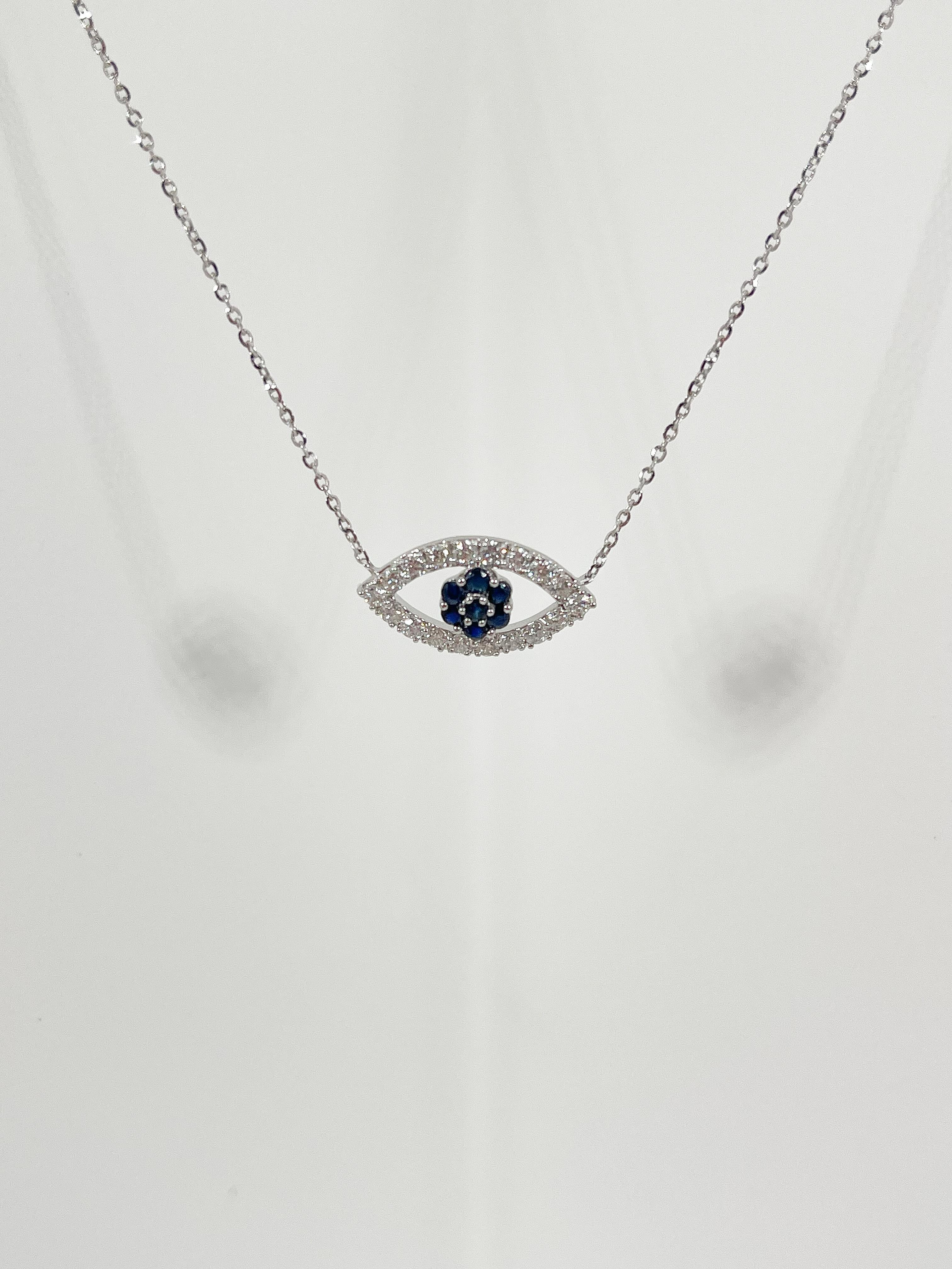 Round Cut 18K White Gold Diamond .50 CTW and Sapphire .25 CTW Evil Eye Pendant Necklace For Sale