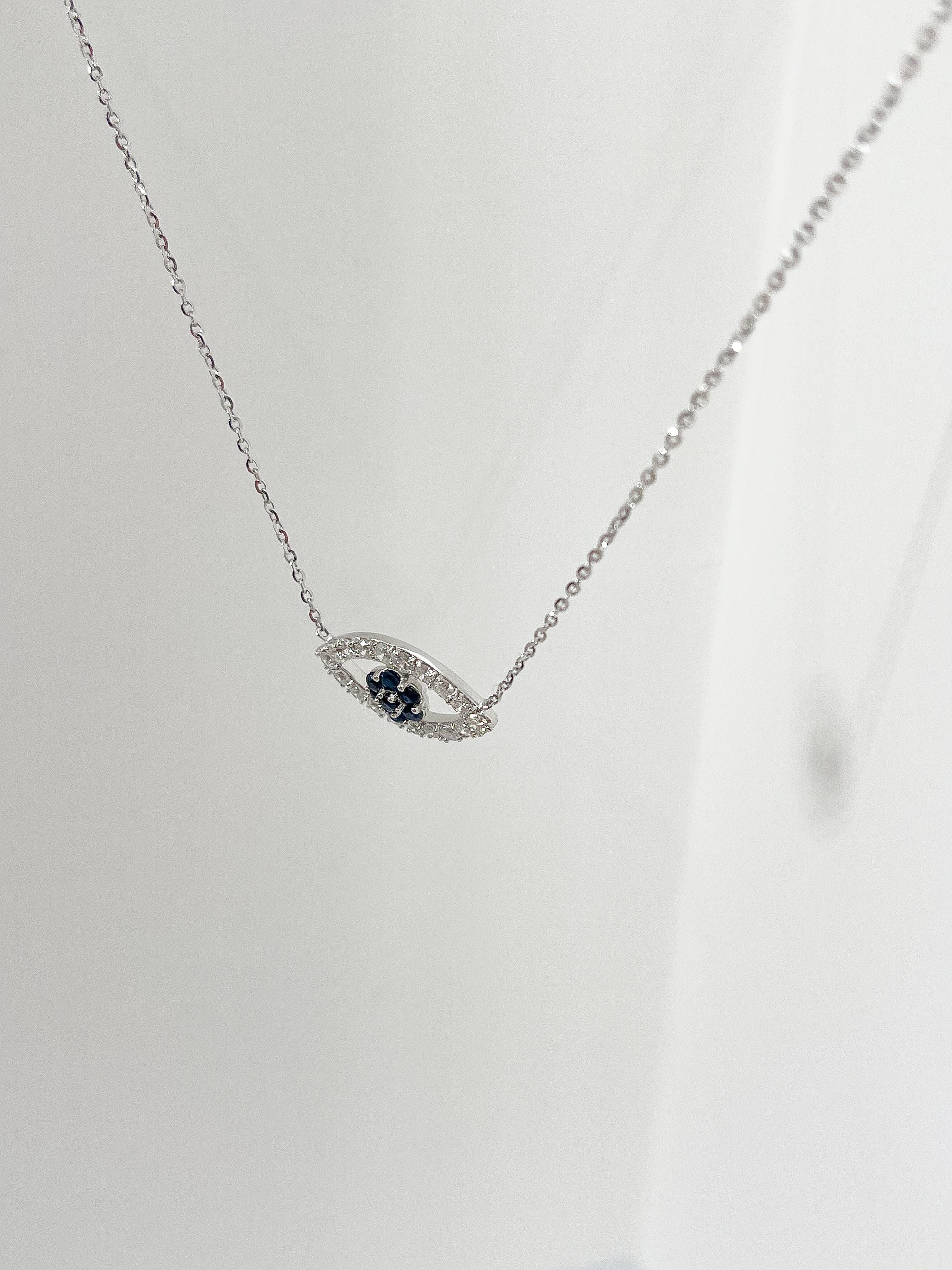 18K White Gold Diamond .50 CTW and Sapphire .25 CTW Evil Eye Pendant Necklace In Excellent Condition For Sale In Stuart, FL