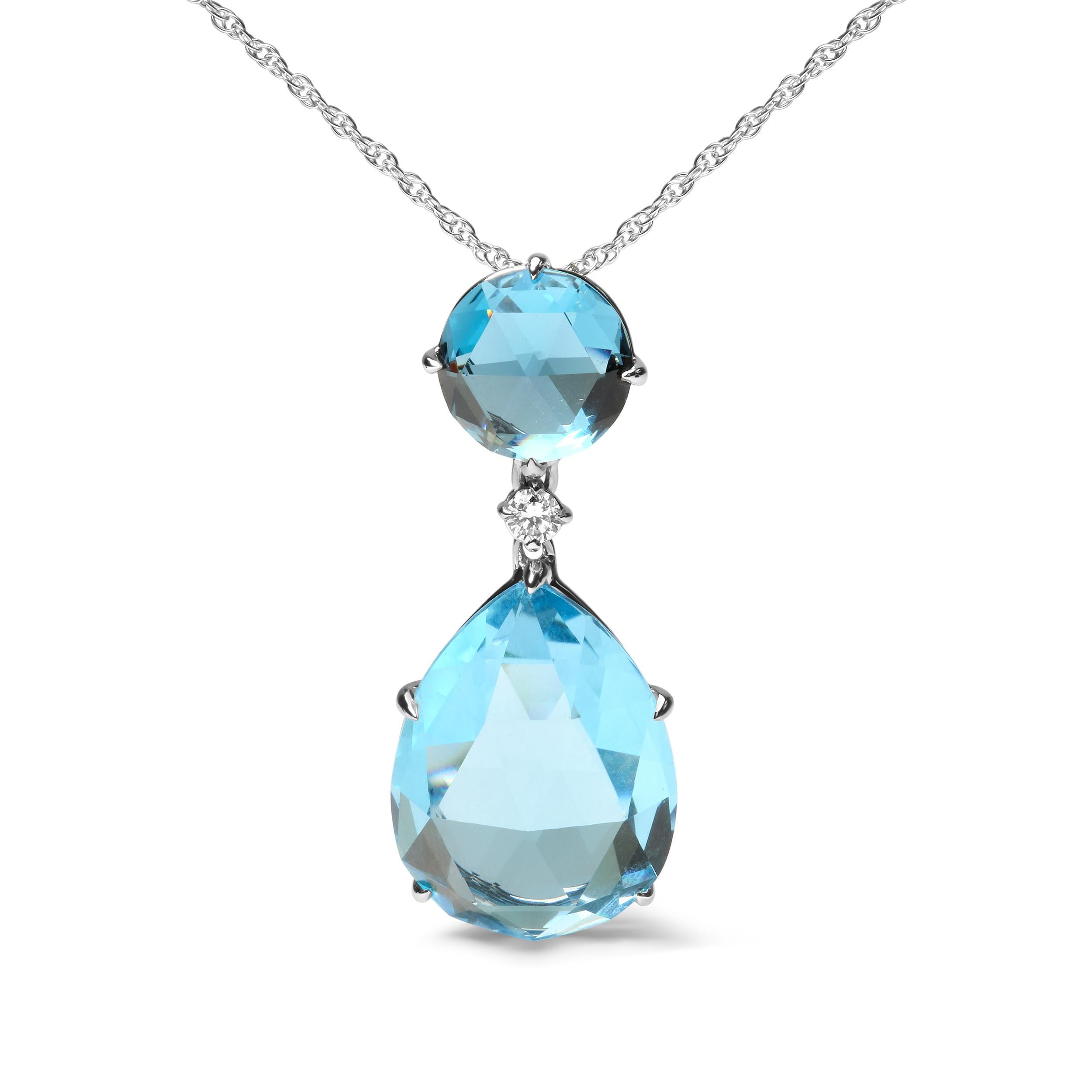 This sparkling 18k white gold pendant necklace is a perfect November gift with two topaz birthstones. The bail consists of a natural 10x10mm round London blue topaz in a prong setting. Below nestles a prong-set round diamond accent stone with an