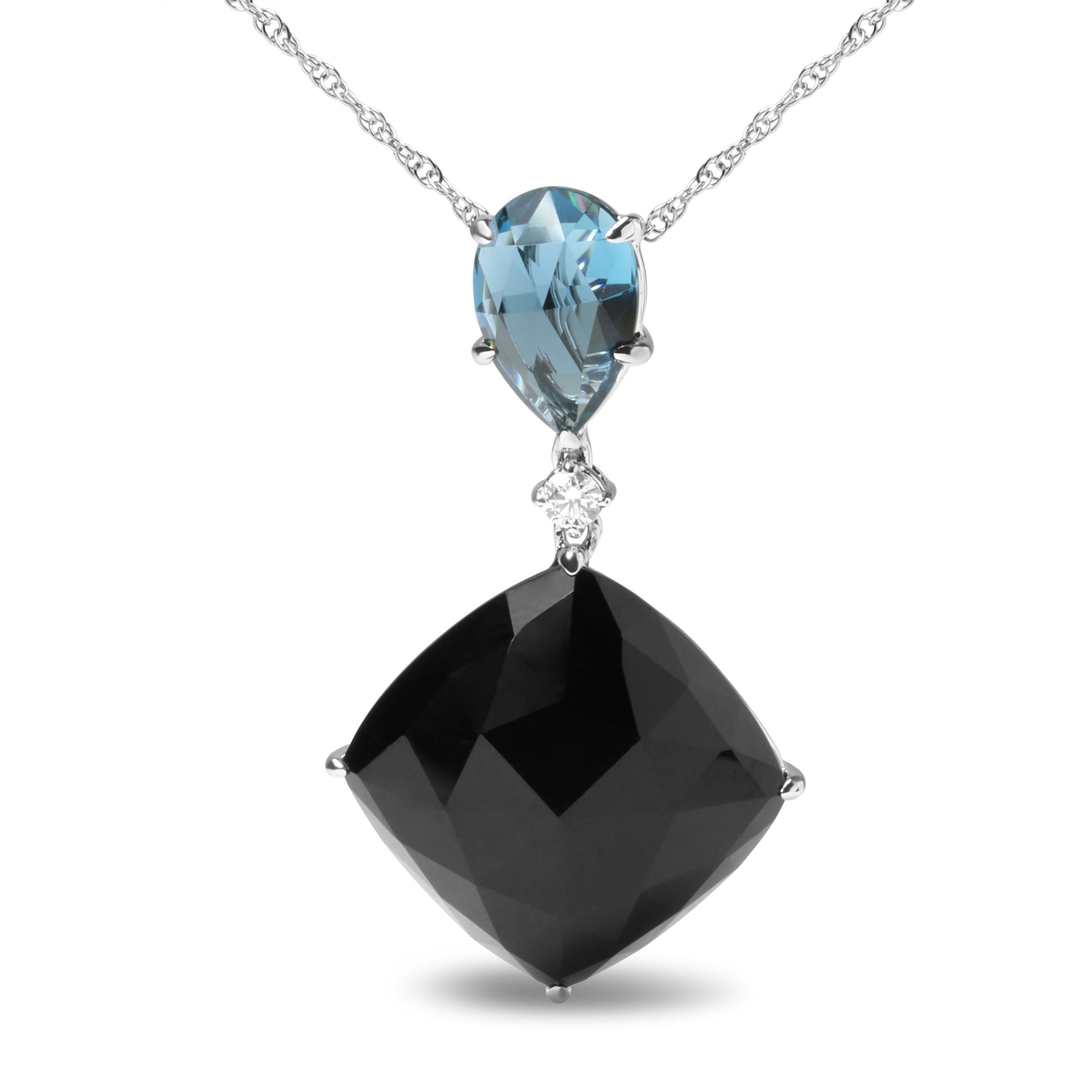 An exquisite design cast in 18k white gold, this pendant necklace is a stylish and sophisticated collaboration of colors to complement the neckline. This piece starts with a natural 12x8mm pear cut heat-treated London blue topaz nestled within a