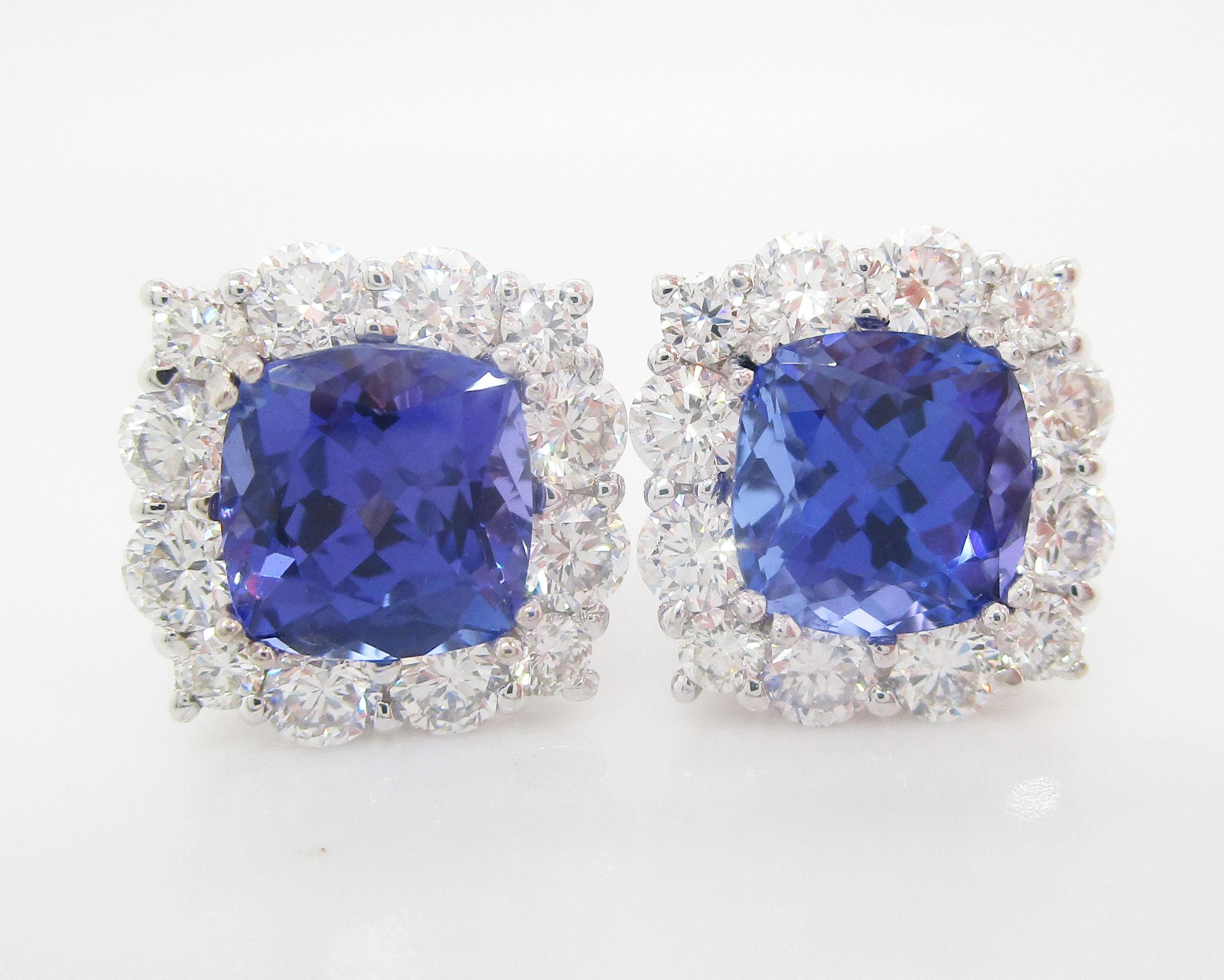 These earrings fill a color spectrum that was unidentified in the 1920s. The colors are showstopping! The stones are extremely well matched and visible from ten tables away. The tanzanites are encircled with G/VS diamonds. These are the perfect