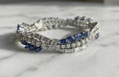 Pulsera de oro blanco de 18 quilates con diamantes y zafiro azul