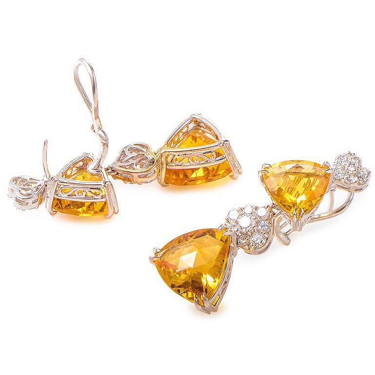 This pair of drop earrings are bright and fashionable. They are made of 18K white gold and are set with citrine stones accented with ~1.98ct of diamonds.