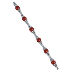 Bracciale con diamanti e corallo in oro bianco 18 carati