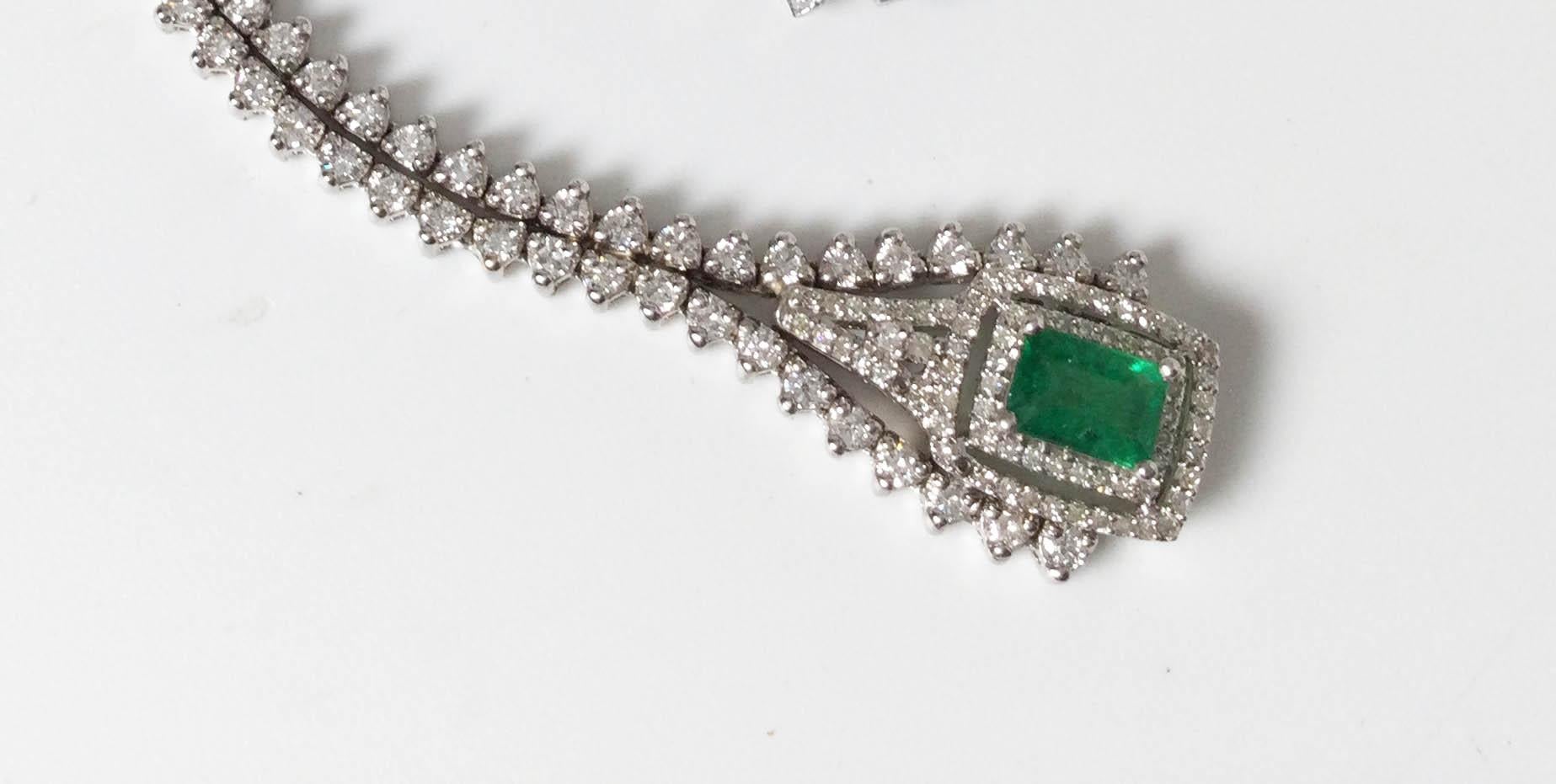 18 karat white gold with natural Columbian emerald and Diamond pendant. 2.12 karat emerald with 4.92 karats of diamonds.
