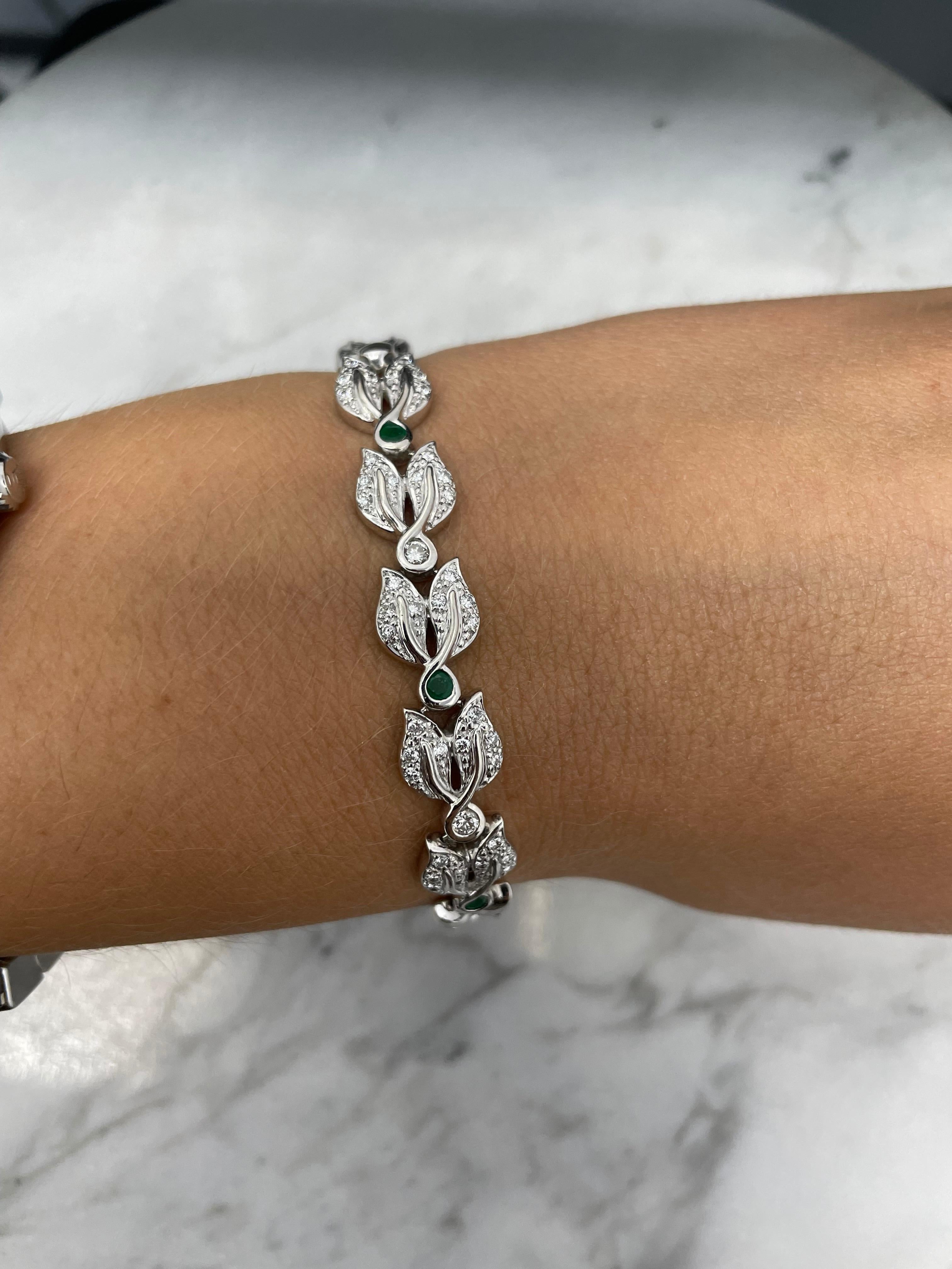 18K White Gold Diamond and Emerald Floral Bracelet

Grams 22.9
