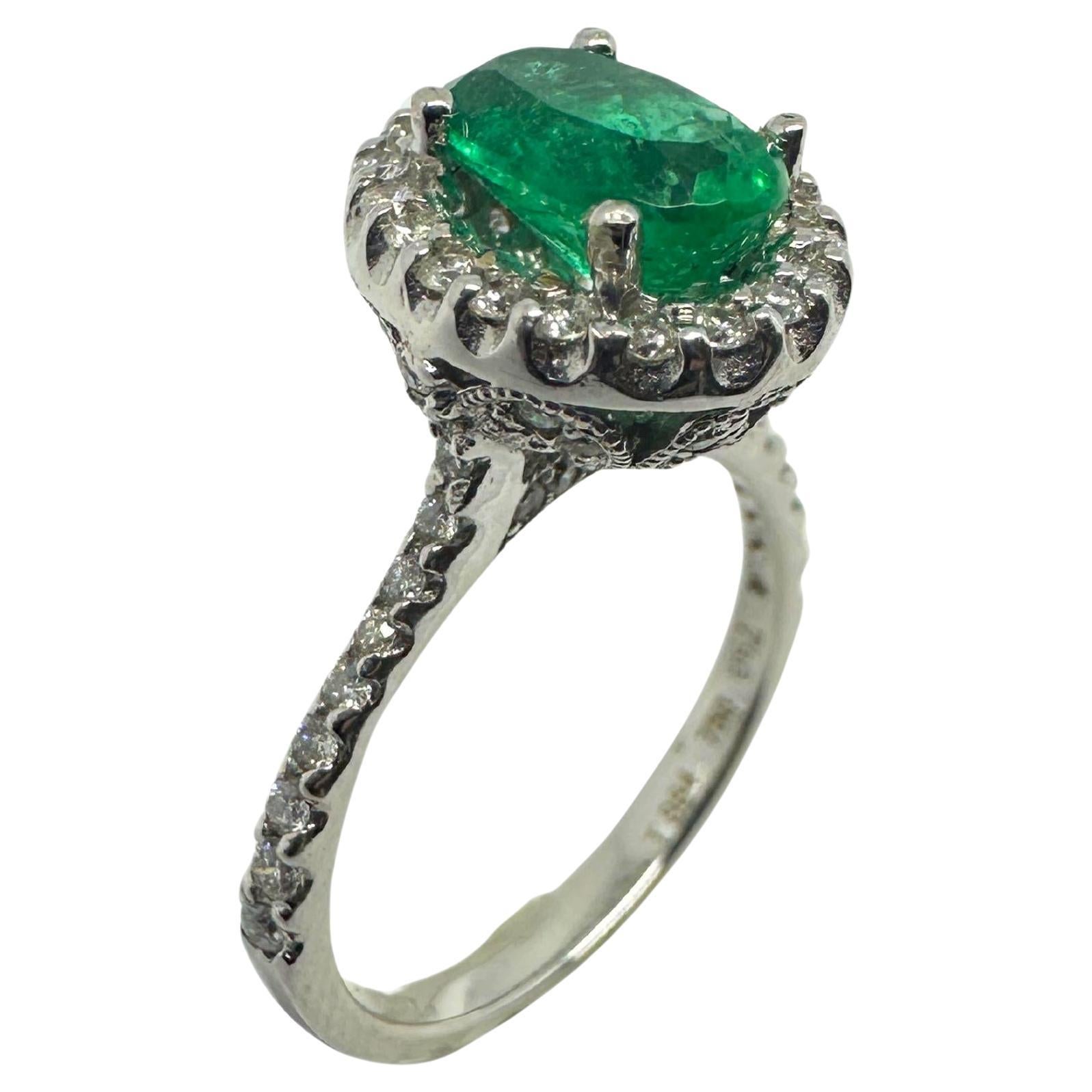 Add a touch of elegance to your jewelry collection with our 18k White Gold Diamond and Emerald Ring. Weighing 4.81 grams and with a size of 6.75, this stunning ring features a 1.44 carat oval emerald at its center, surrounded by a sparkling diamond