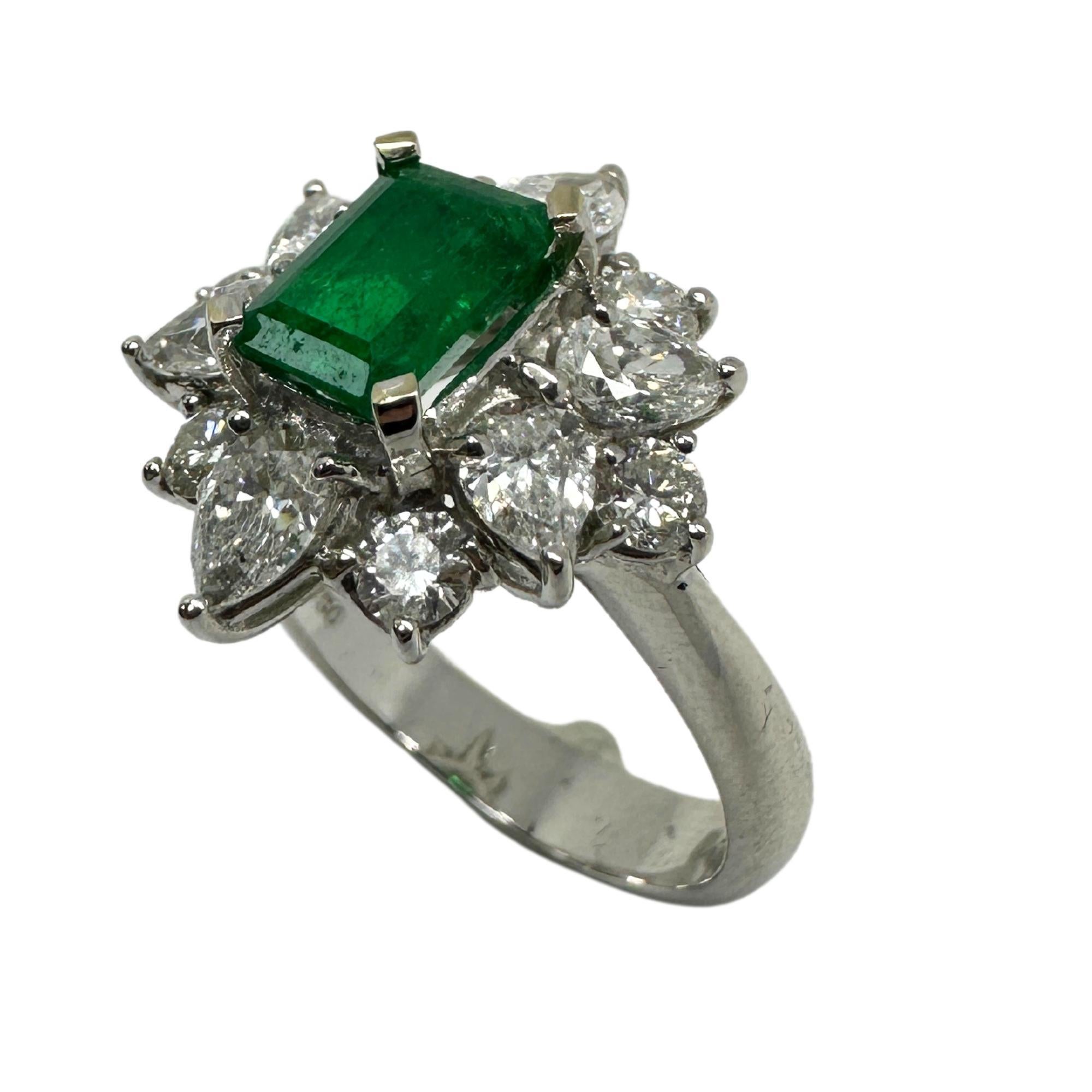 18k Diamond and Emerald Ring. 
Condition: In good condition with some minor surface wear consistent with age.
Ring size: 6.25
Markings: “T864” 