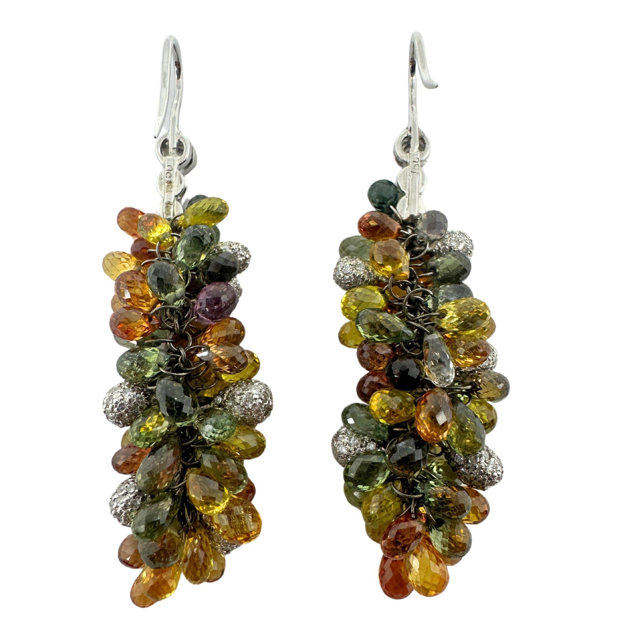 Elevate any look with our stunning 18k Diamond and Multi Color Sapphire Briolette Earrings. Crafted in 18k white gold, these 2 inch long earrings feature 2.48 carats of dazzling diamonds and 45.47 carats of vibrant multi color sapphires. Lightweight