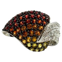 Anillo de oro blanco de 18 quilates con diamantes y varios zafiros