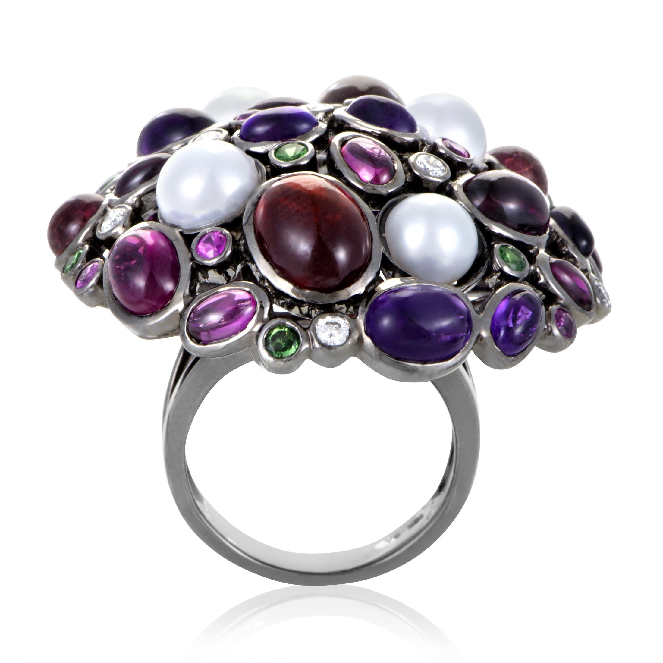 This ring is truly extraordinary with its rhythmic use of gorgeously colored gemstones. The ring is made of 18K white gold and is accented with a crown of gems that vary in size, shape, and color. Absolutely stunning!<br />Ring Top Dimensions: 35 x