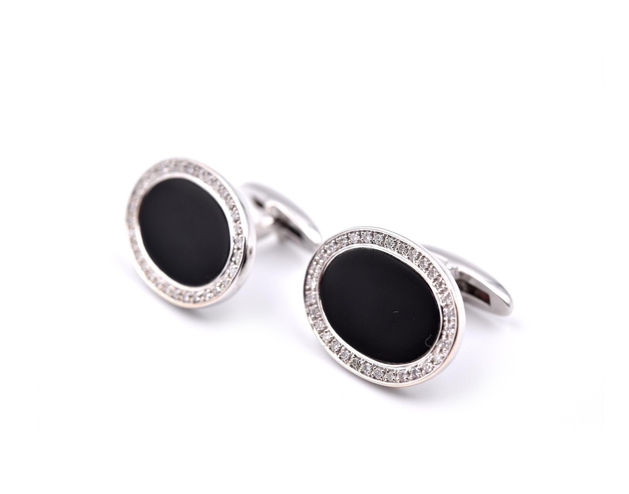 Designer: custom
Material: 18k white gold & Onyx
Diamonds: 66 round cuts= 0.40cttw
Color: G
Clarity: VS
Dimensions: each cufflink measures 19.37mm by 14.50mm
Weight: 8.17 grams

