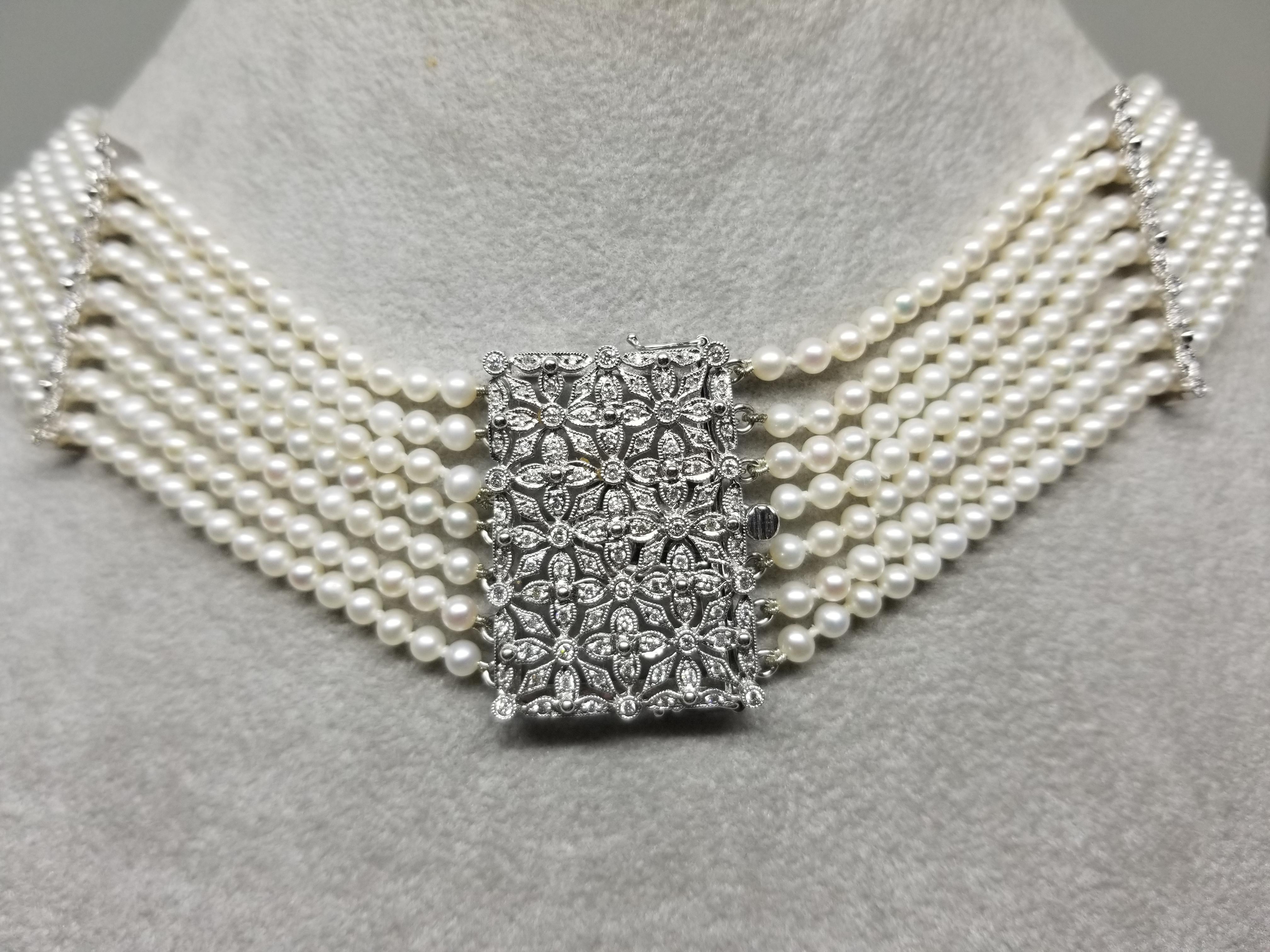 Gorgeous 18k white gold diamond and pearl collar pendant, containing 100 round full cut diamonds; color 