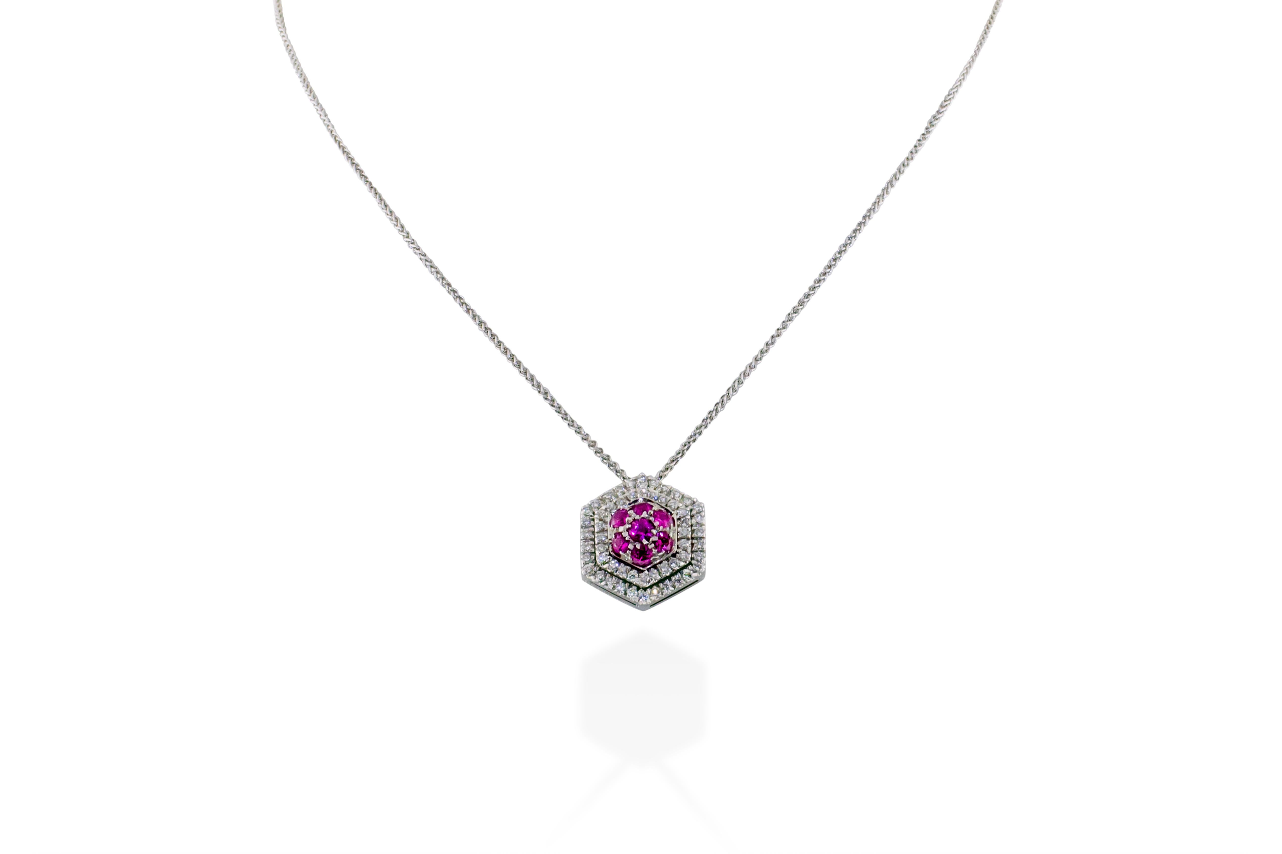 This necklace features a pendant containing 1 carat of G-H VS diamonds set alongside pink sapphires in 5 grams of 18K gold. Chain drop is approximately 8 inches. Made in Italy. 


Viewings available in our NYC showroom by appointment.

