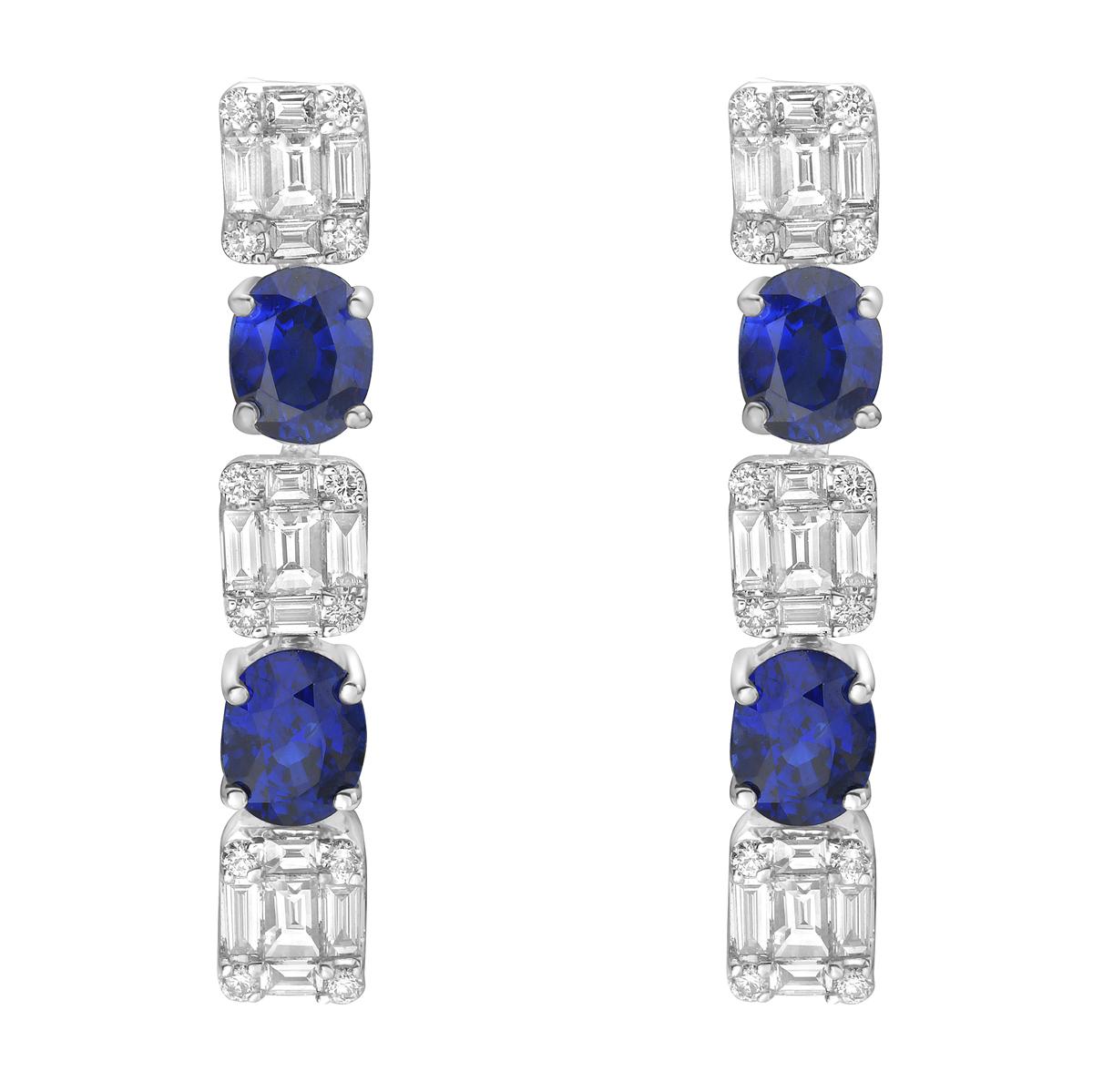 These beautiful drop earrings are made with 18K white gold and are designed to shine. Each earring features a lovely mix of diamonds and sapphires that sparkle with every move. There are four deep blue sapphires in total, weighing 1.7 carats, which