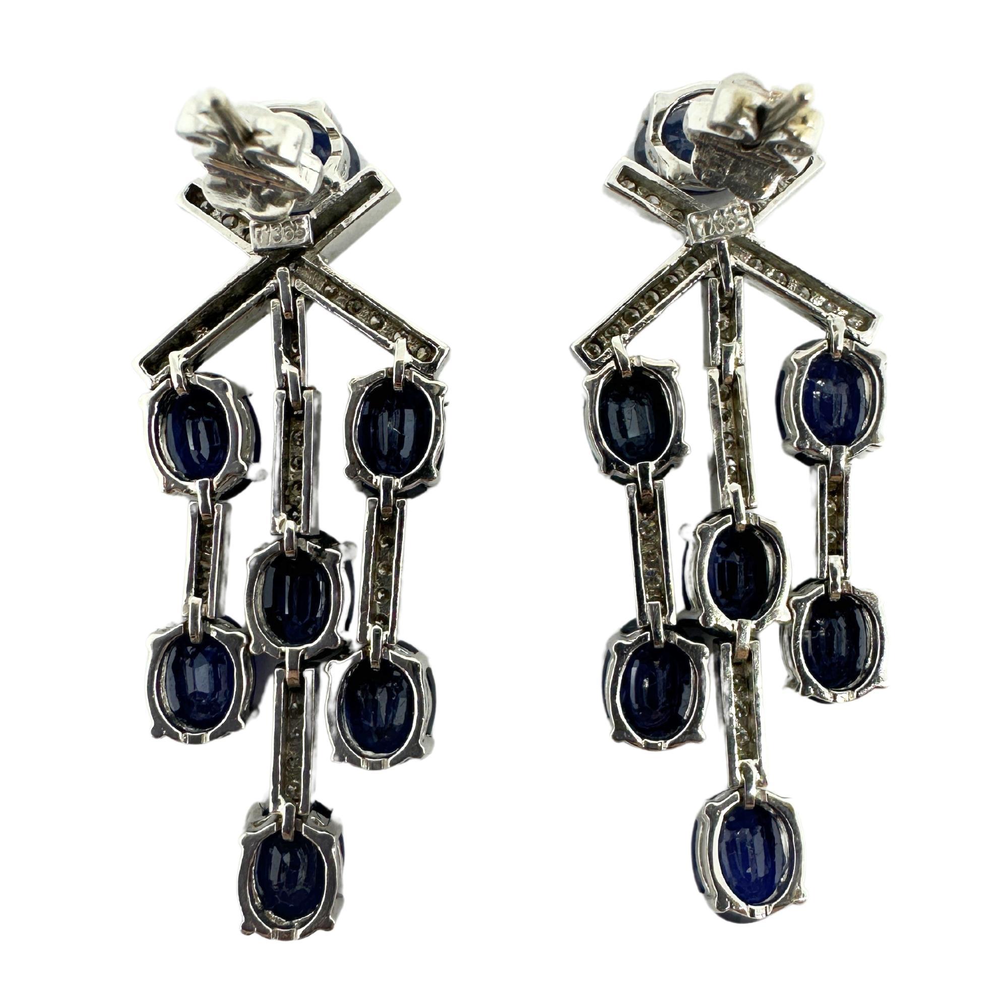 Elevate any outfit with these stunning 18k White Gold Diamond and Sapphire Earrings. With a total weight of 0.81 carats of diamonds and 13.26 carats of sapphires, these earrings will make a statement. In excellent condition, these 1.75 inch earrings