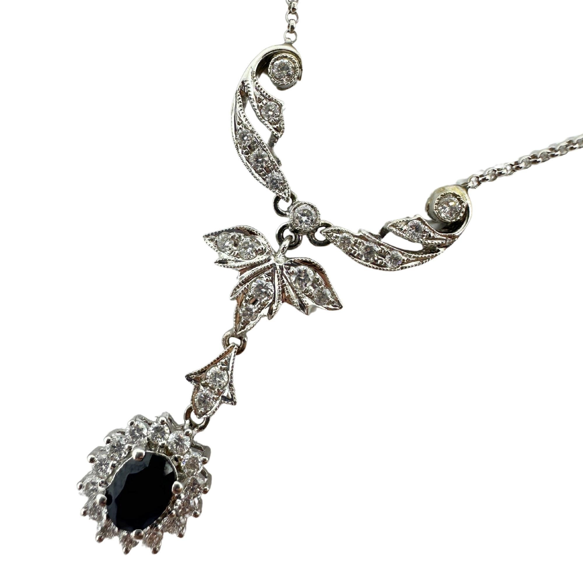 Elevate your jewelry collection with our stunning 18k Diamond and Sapphire Necklace. Crafted with 4.9 grams of luxurious 18k white gold, its 0.67 carats of diamonds and 0.52 carats of sapphire will add a touch of sophistication and elegance to any