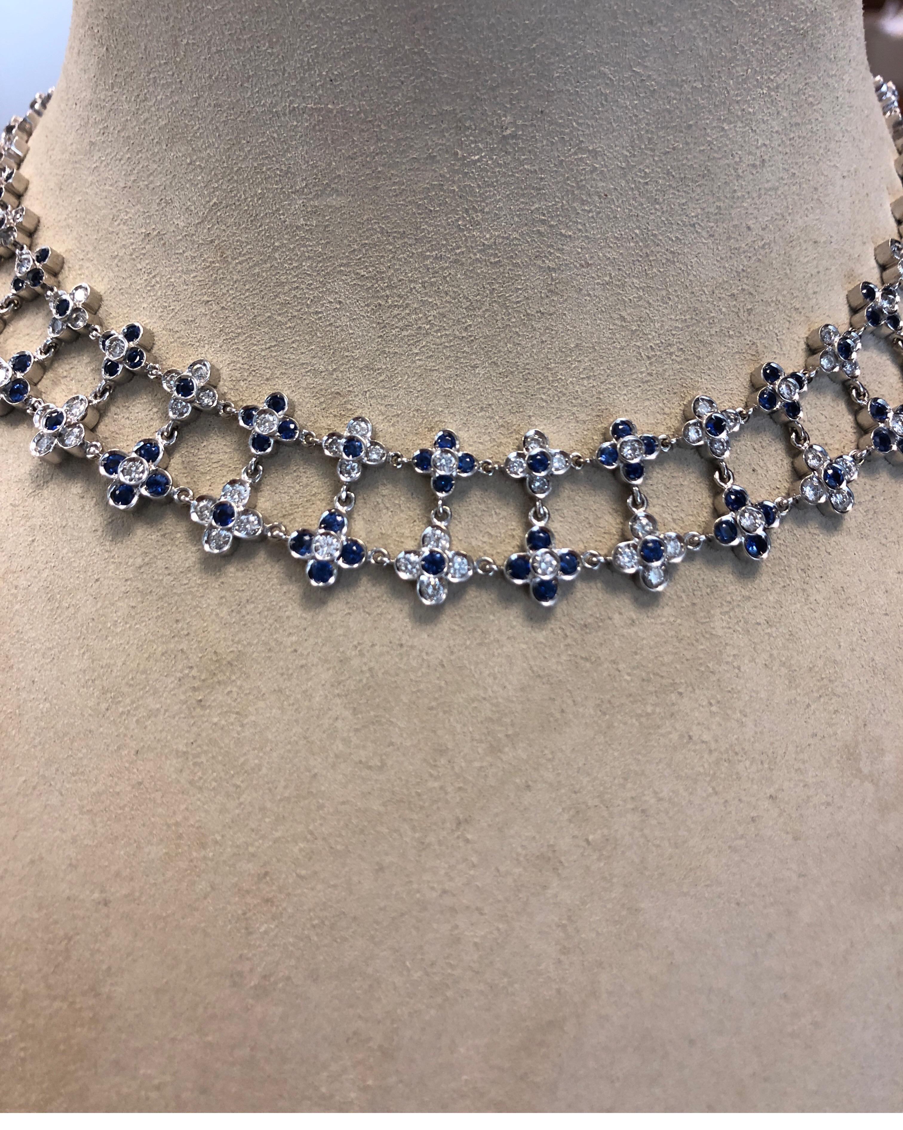 18K white gold two row necklace, with flower motif, bezel set with full cut round diamonds weighing 6.57cts and faceted blue sapphires weighing 9.41cts, length 16 inches and width .75 inches.
Last retail $21,500