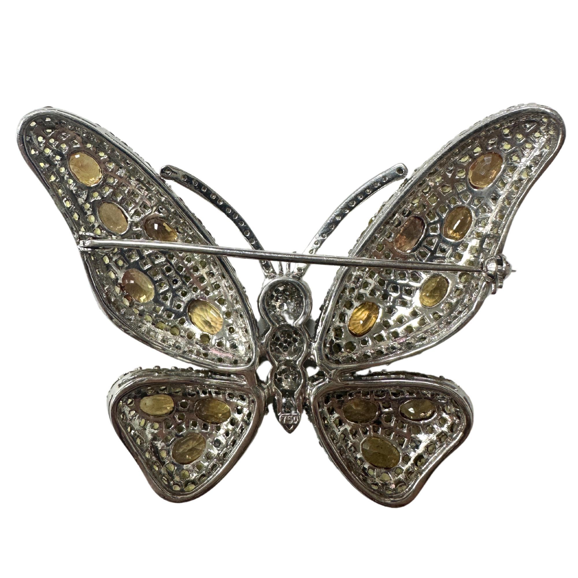 18K White Gold Diamond and Yellow Sapphire Butterfly Brooch. This brooch is made up of 20.31 carats of yellow sapphire and 1.82 carats of white diamonds. 

18K White Gold Diamond and Yellow Sapphire Butterfly Brooch
Condition: In good condition with