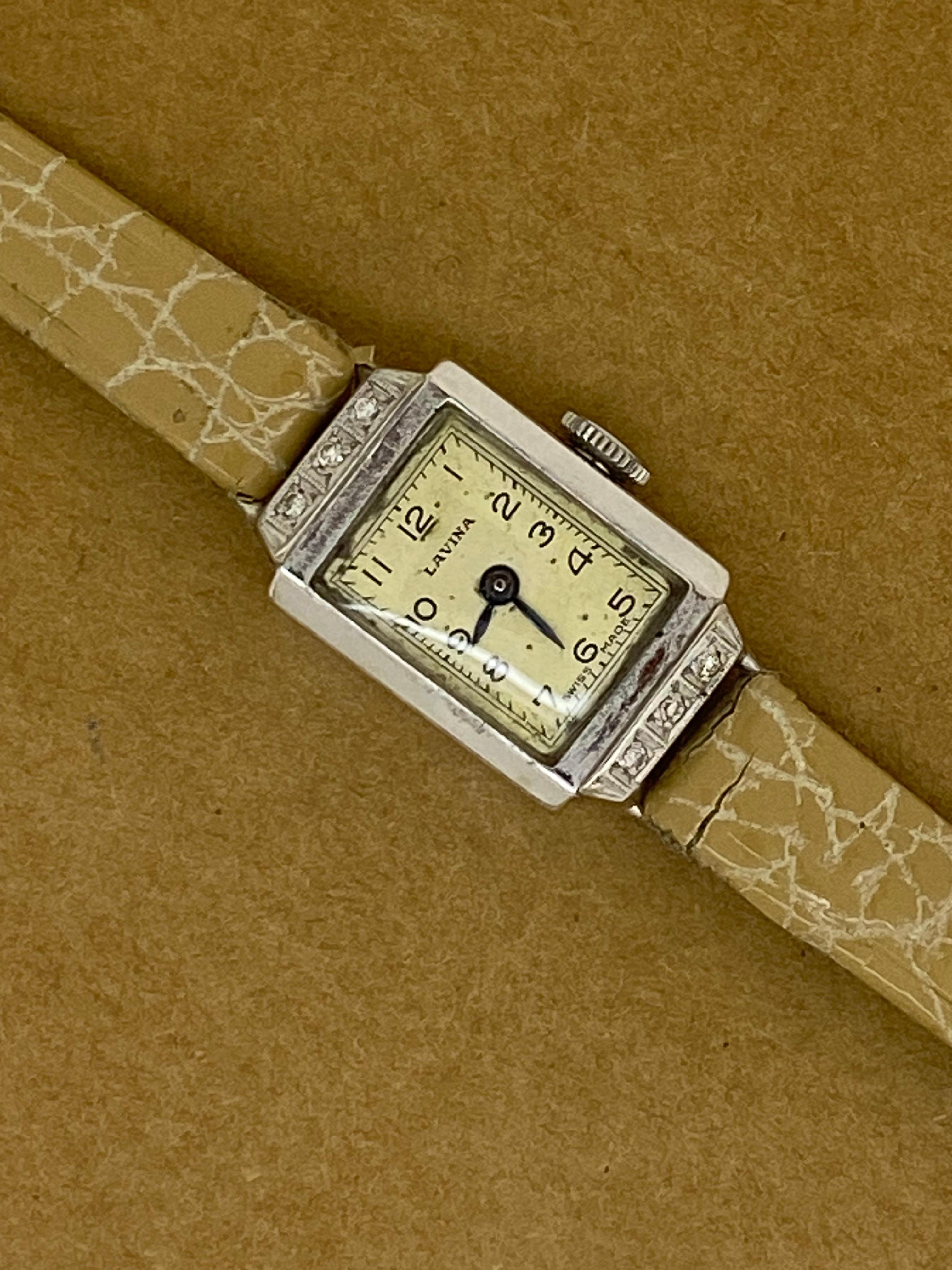 This ladies' dress watch is from Art-Deco period, 
yet it's in beautiful vintage condition & 
in excellent working order.

It features: 

18K White Gold 15mm x 22mm Rectangle Case,
decorated with 6 old-cut diamonds 
of good colour & clarity 

Swiss