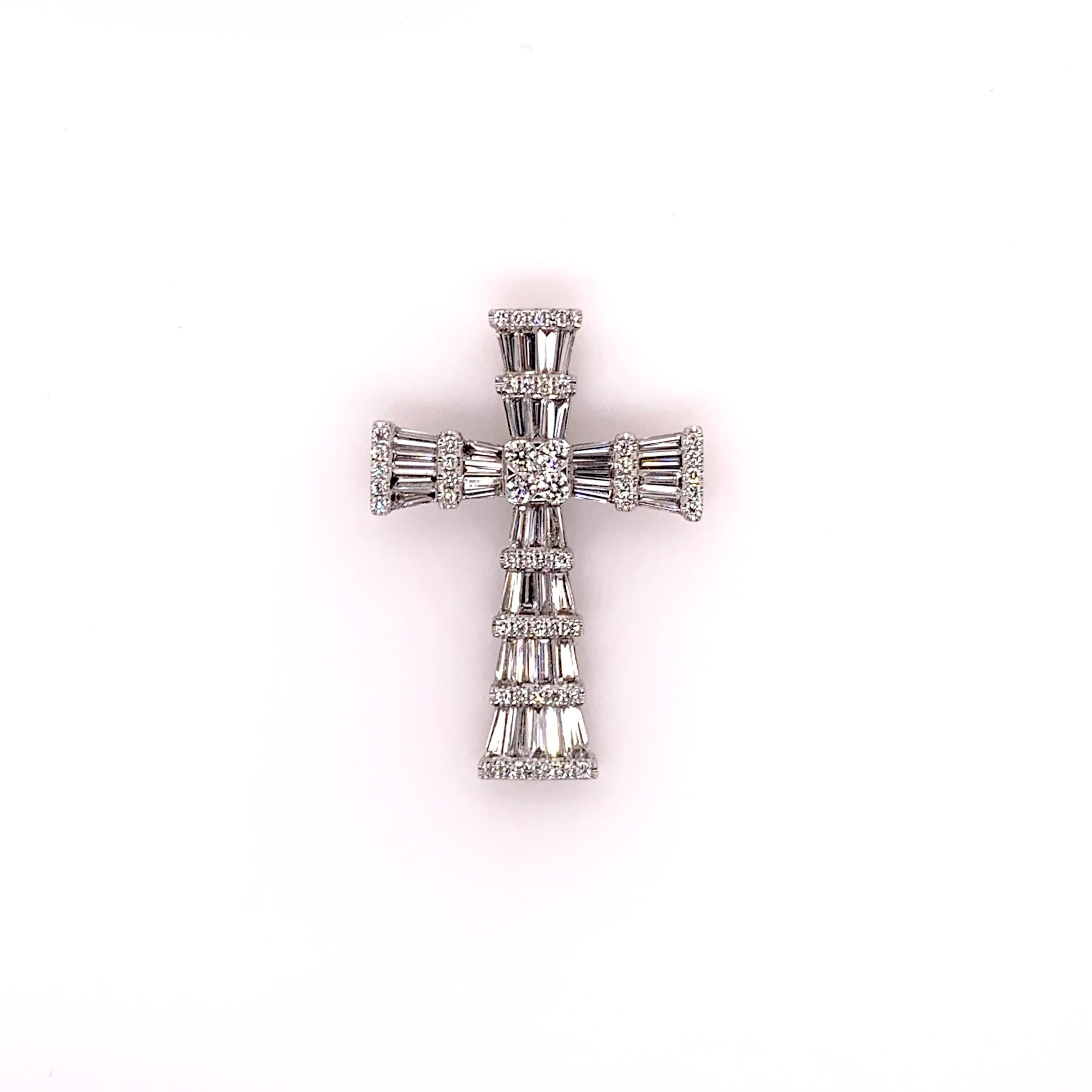 18k white gold, custom made diamond baguette cross with round brilliant accents will truly be an exquisite addition to anyones jewelry collection.  The fine details are exemplified in the graduated arms with the tapered baguettes.  The generous size