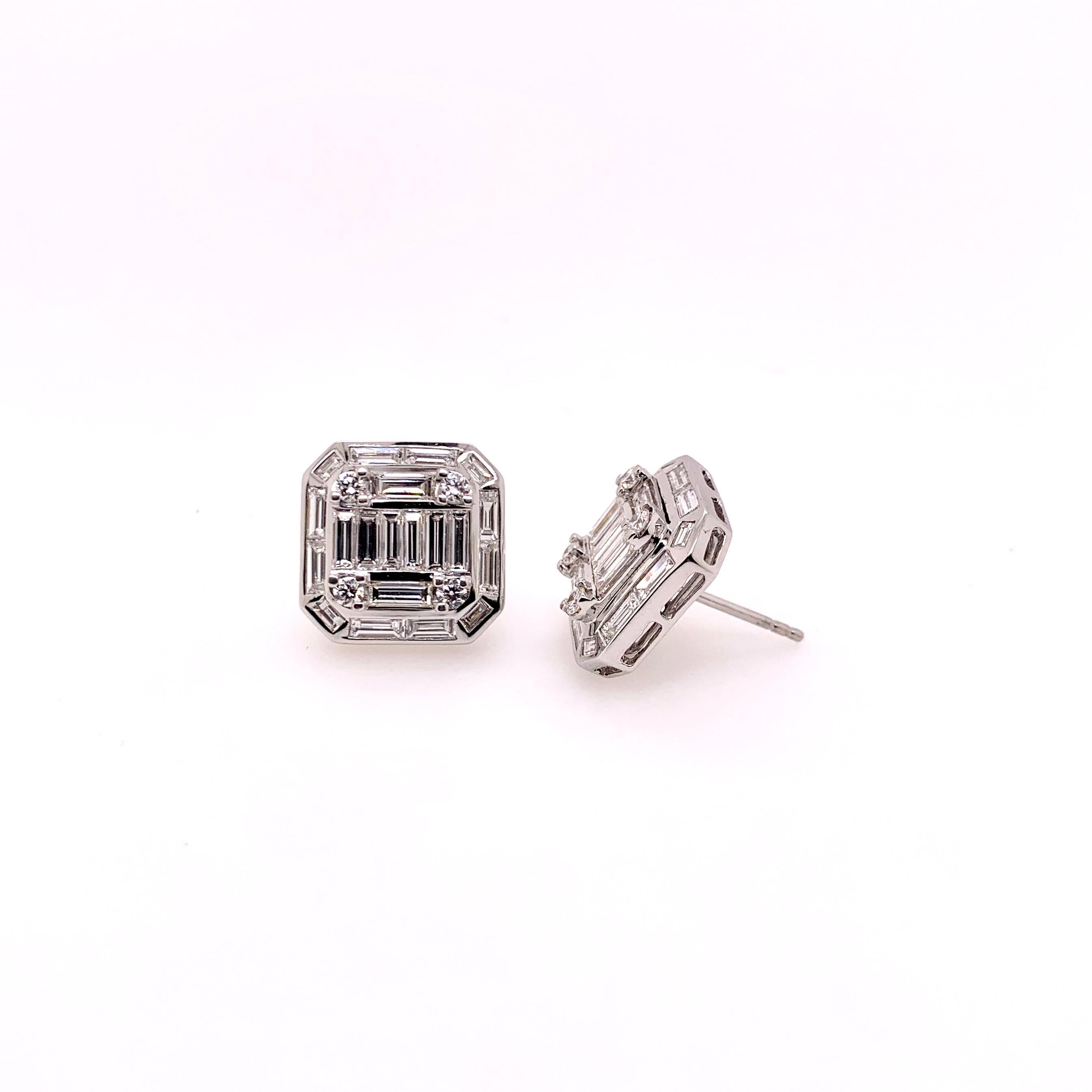These baguette diamond earrings are absolutely breathtaking!  The workmanship involved using the 6 straight baguettes across the center displays the clean lines that is surrounded further by baguettes and round brilliant diamonds in this 18k white