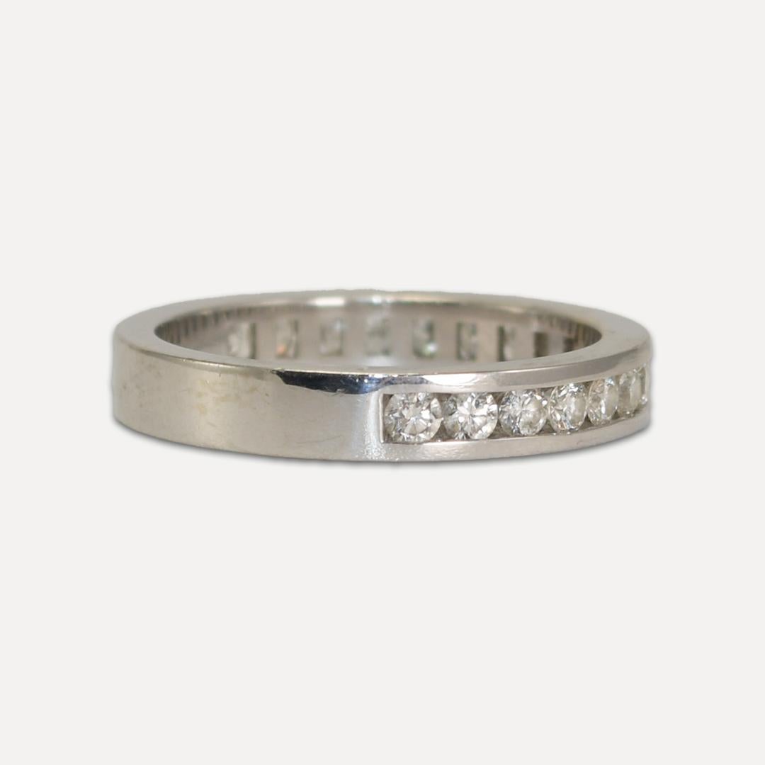 Ladies 18k white gold and diamond band.
Tests 18k and weighs 3 grams.
The diamonds are round brilliant cuts, .50 total carats, G, H to I color range, Vs clarity, good cuts.
The diamonds go around 65 to 70% of the ring.
The ring measures 3mm