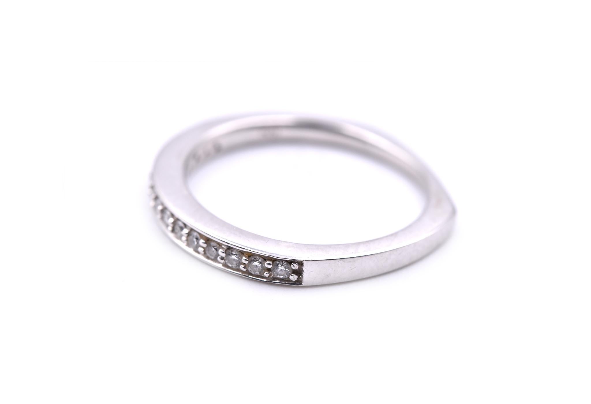 Designer: custom design
Material: 18k white gold
Diamonds: 15 round brilliant cut = .25cttw
Color: G
Clarity: VS
Ring size: 7 ½ (please allow two additional shipping days for sizing requests)
Dimensions: ring is 2.40mm wide
Weight: 3.04 grams 
