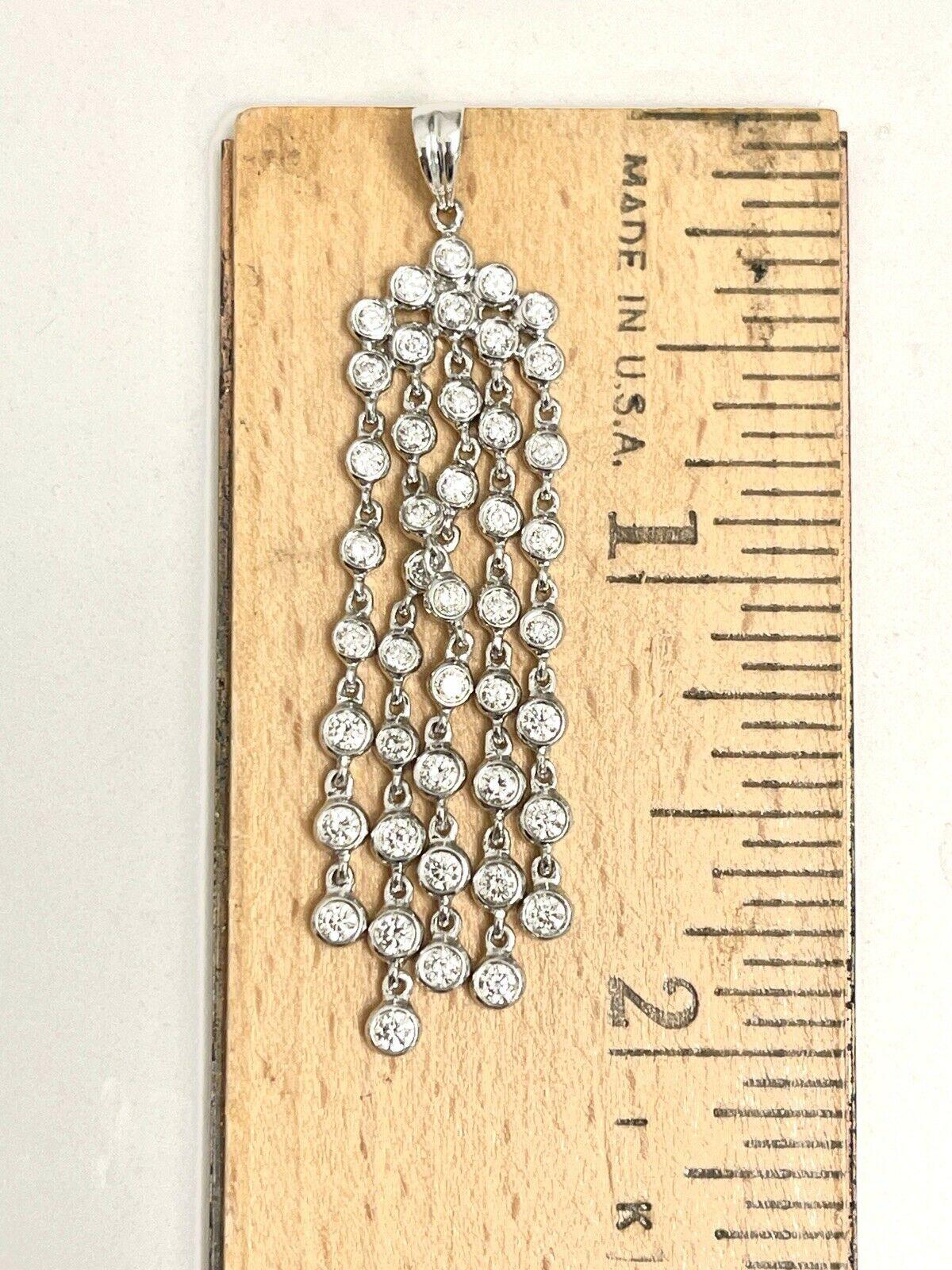  Specifications:
    MAIN stone: ROUND DIAMOND
    DIAMOND: 45 PIECES 
    CARAT TOTAL WEIGHT: approx 1.14 CTW
    COLOR/clarity: G/SI
    brand: UNBRANDED
    metal: 18K WHITE GOLD
    type: PENDANT
    weight: 4.70 GRS 
    LENGTH: NO CHAIN
   