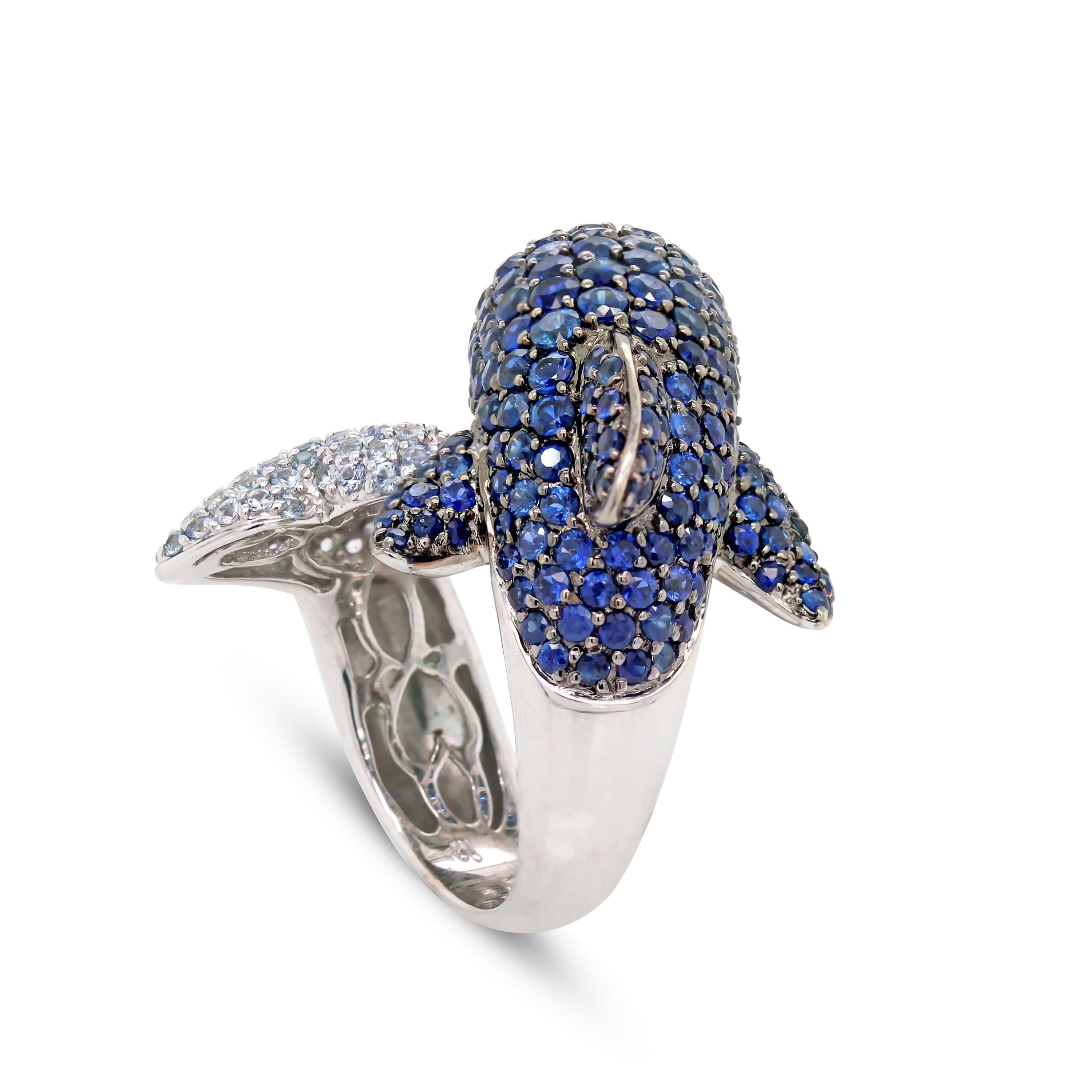 Round Cut 18 Karat White Gold and Diamonds Blue White Sapphires Ruby Dolphin Bypass Ring For Sale