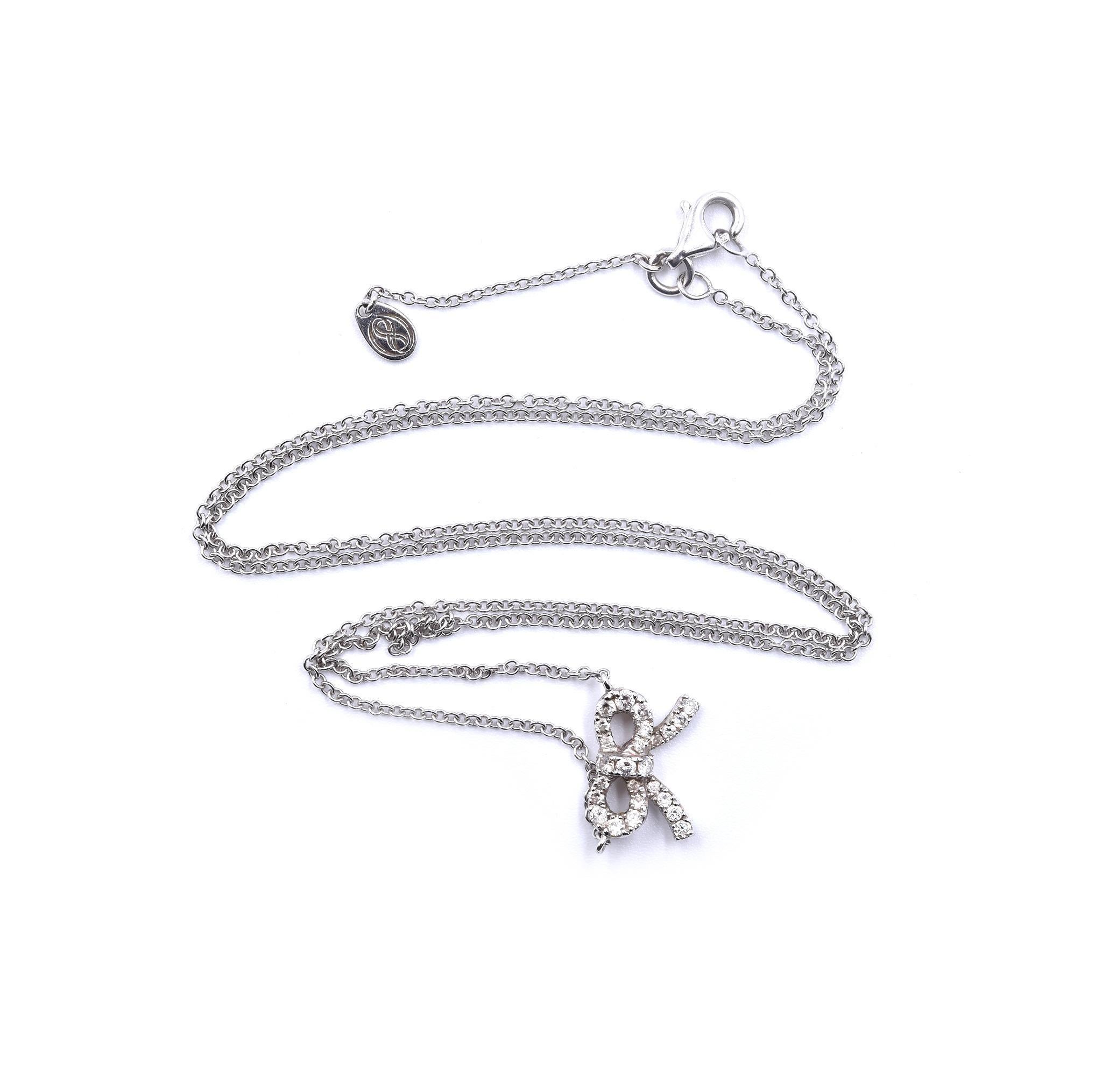 Designer: custom design
Material: 18k white gold
Diamonds: 24 round brilliant cut= .25cttw
Color: G
Clarity: VS
Dimensions: necklace is 18-inches long 12mm wide
Weight: 3.66 grams