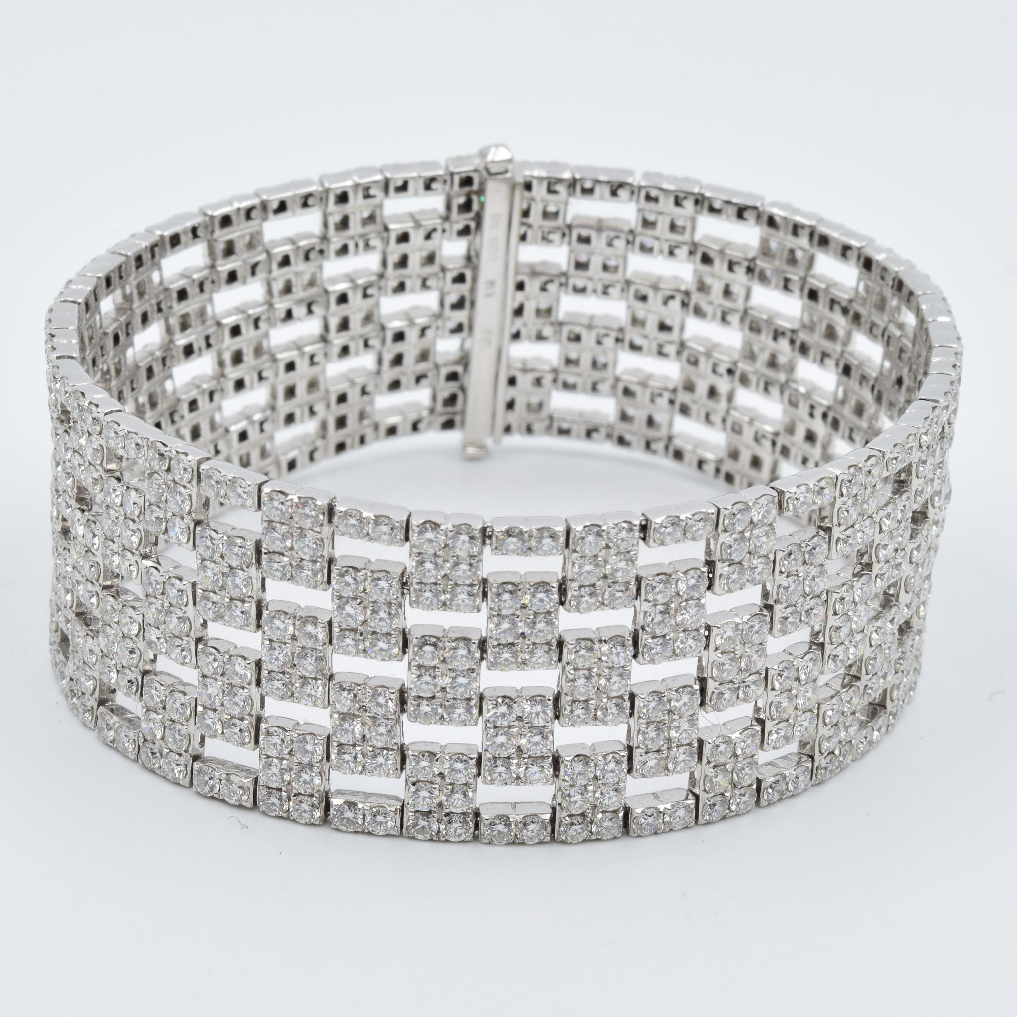 This beautiful bracelet has nearly 21 carats of pave set diamonds set in this unique checkered pattern.  The diamonds are all G color VS clarity in range.  This bracelet is brand new and is a retail of $39,900.  Please let us know if you have any