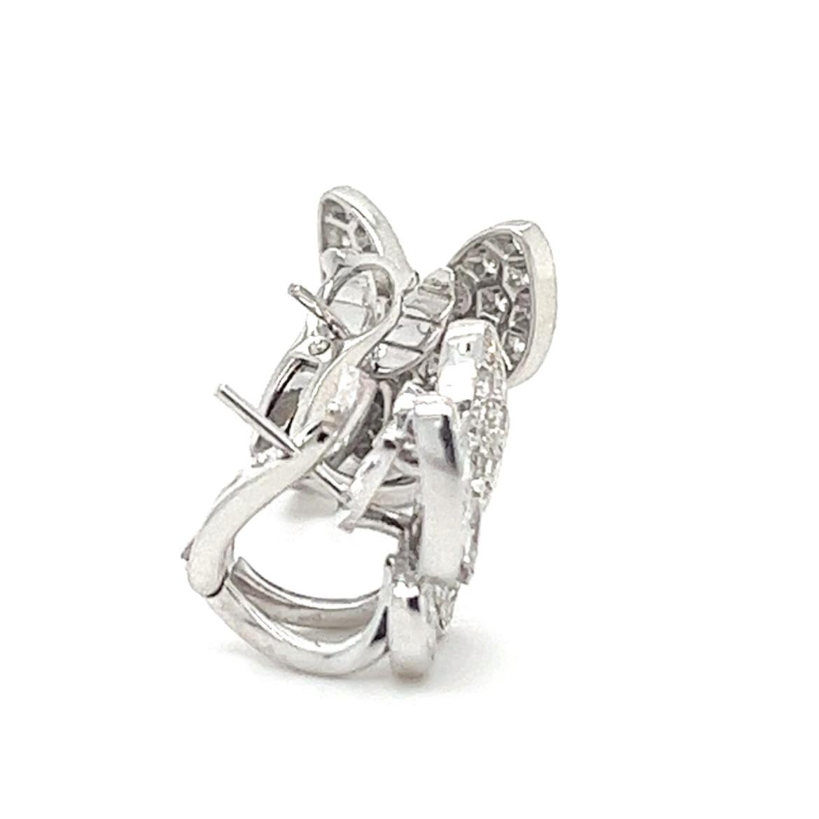 18K White Gold Diamond Butterfly Earrings 

18K White Gold - 9.736 GM
2 Diamonds - 0.210CT
68 Diamond - 1.321 CT

These exquisite 18K white gold earrings feature a captivating butterfly design that exudes elegance and sophistication. The delicate