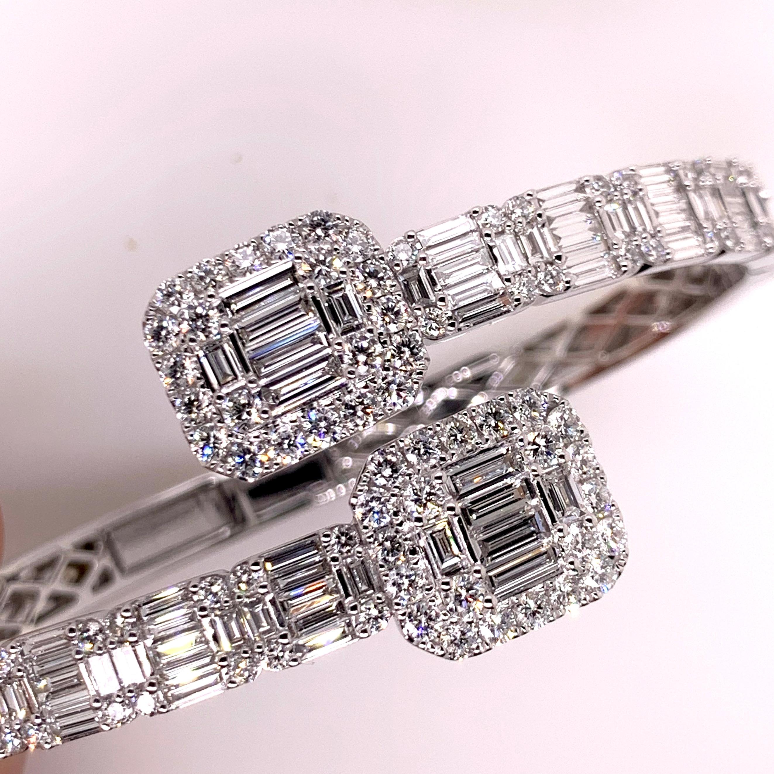 This stunning diamond bangle will definitely grasp everyone's attention!  The bypass style enables easy access on and off while delivering a contemporary design that will make your wrist glamorous!  

Diamonds:  5.61 cts, Baguettes & Round Brilliant