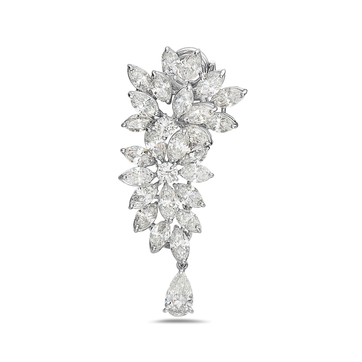 These Harry Winston style diamond chandelier earrings feature 22.70 carats of F-G VS diamonds set in 18K white gold. The 22.70 carats of diamonds are made up of 49 marquise brilliant diamonds weighing 19.8 carats, 4 round brilliant diamonds weighing