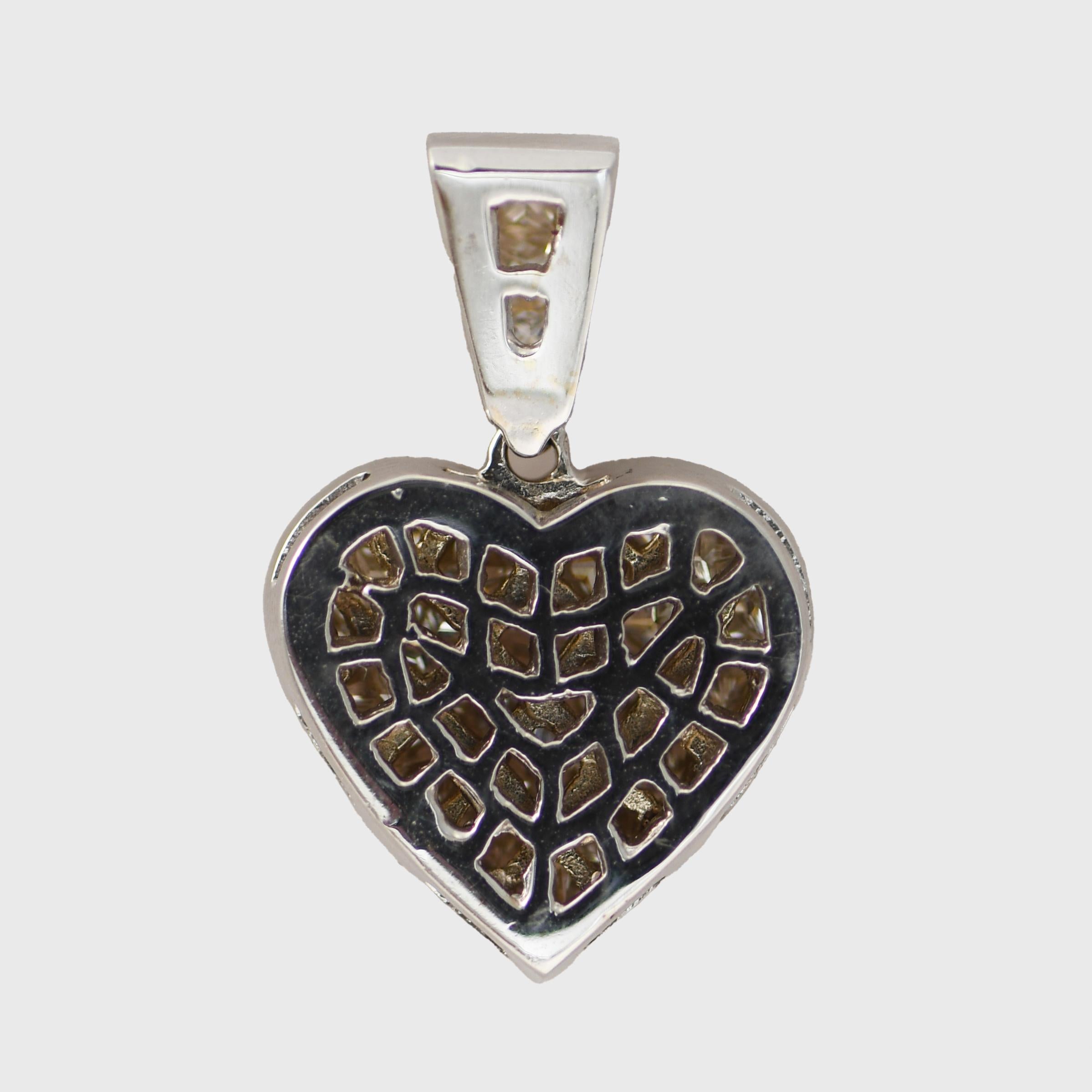 18K White Gold Diamond Cluster Heart Pendant 2.00tdw, 7g
Diamond cluster heart pendant with 18k white gold setting.
Tests 18k with an electronic tester and weighs 7 grams gross weight.
The diamonds are princess cuts, g, h, i color range, Si