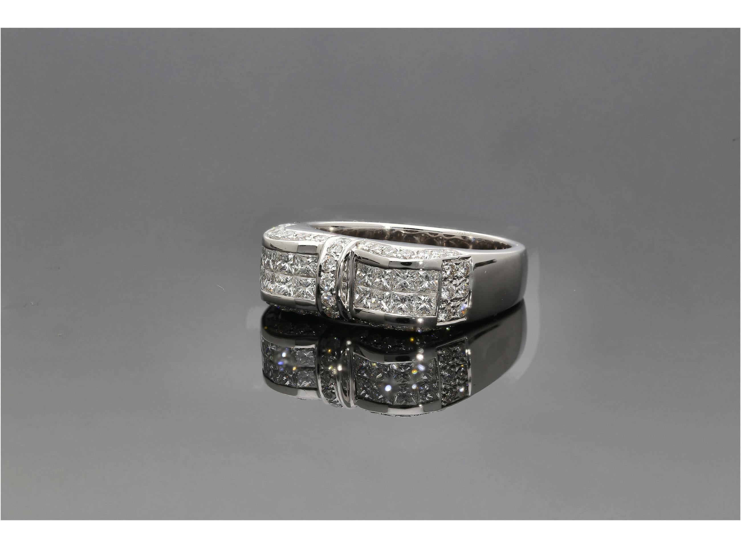 This ring is for someone in search of a chic and classy statement piece that no one else has. A ring that communicates a taste of avant-garde jewelry. The ring boasts 16 princess cut diamonds, totaling 0.74 carats, and another 47 round cut diamonds