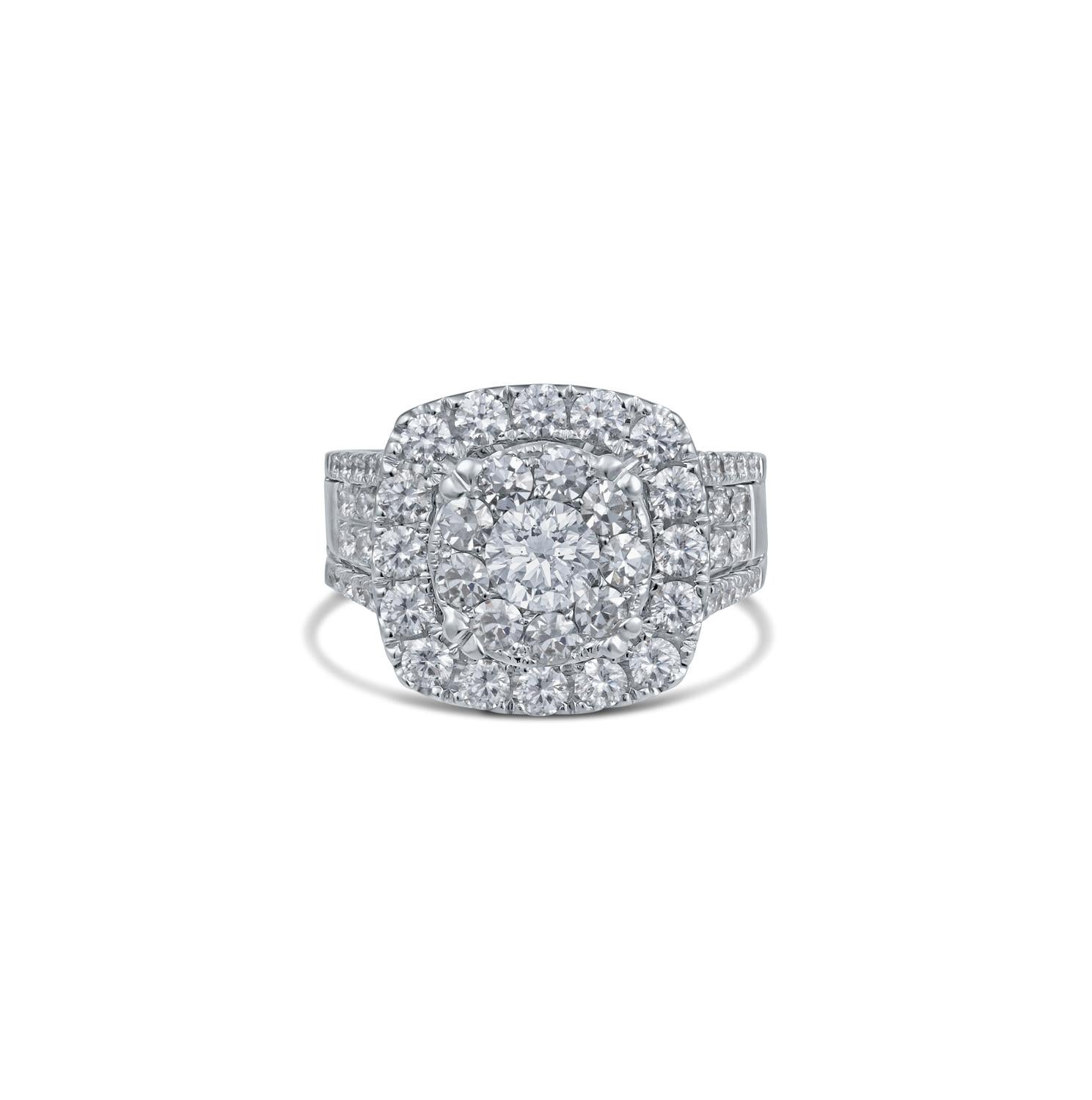 Elevate your style with our breathtaking 18K White Gold Diamond Cluster Ring, a masterpiece that radiates timeless beauty and opulence. At its heart, a dazzling 0.45-carat round diamond takes center stage, capturing the essence of elegance with its