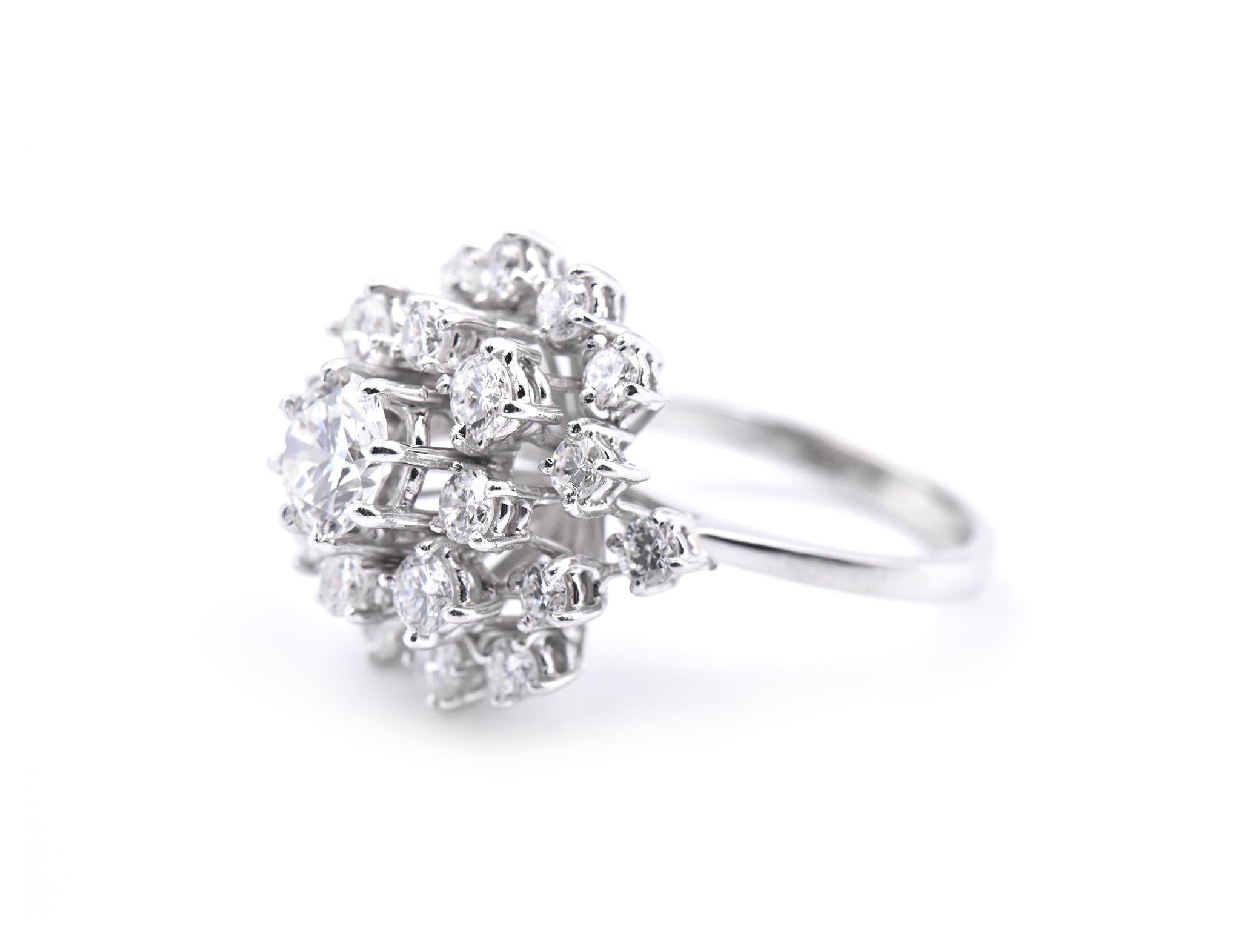 Designer: custom design
Material: 18k white gold
Center Diamond: round brilliant cut = 0.80ct
Color: F-G
Clarity: VS
Accent Diamonds: 22 round brilliant cuts = 1.35cttw
Color: F-G
Clarity: VS
Ring Size: 6 ¼ (please allow two additional shipping days