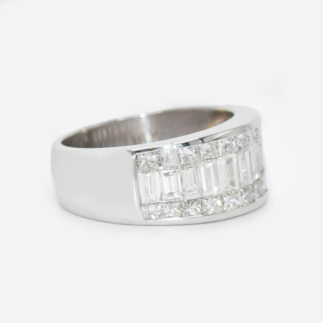 18K White Gold Diamond Cocktail Ring 2.00tdw, 9.1g
Ladies diamond cocktail ring in 18k white gold setting.
Stamped 18k and weighs 9.1 grams.
The diamonds baguette cuts in the middle and square princess cuts on the outside edges, 2.00 total carats,
