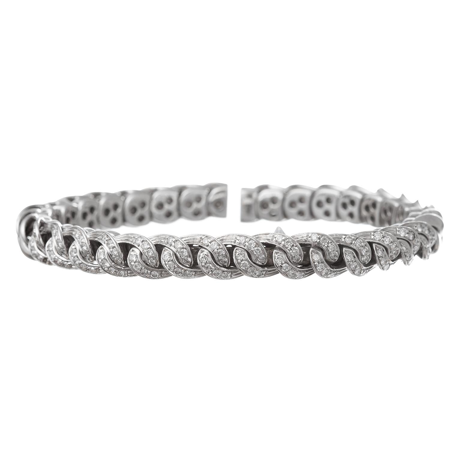 Flexible curb link design cuff bracelet in 18k white gold, the front accented by round brilliant-cut diamonds.  112 diamonds weighing approximately 1.68 total carats (G-H color, VS1-VS2 clarity).  Stamped 'ITALY' '750'.  Stackable cuff, we have two